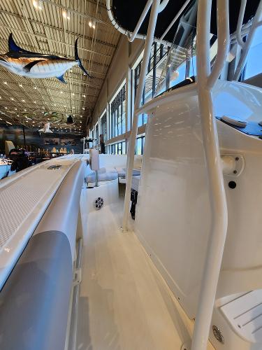 2025 Mako 214 CC boat interior with sleek design in showroom.