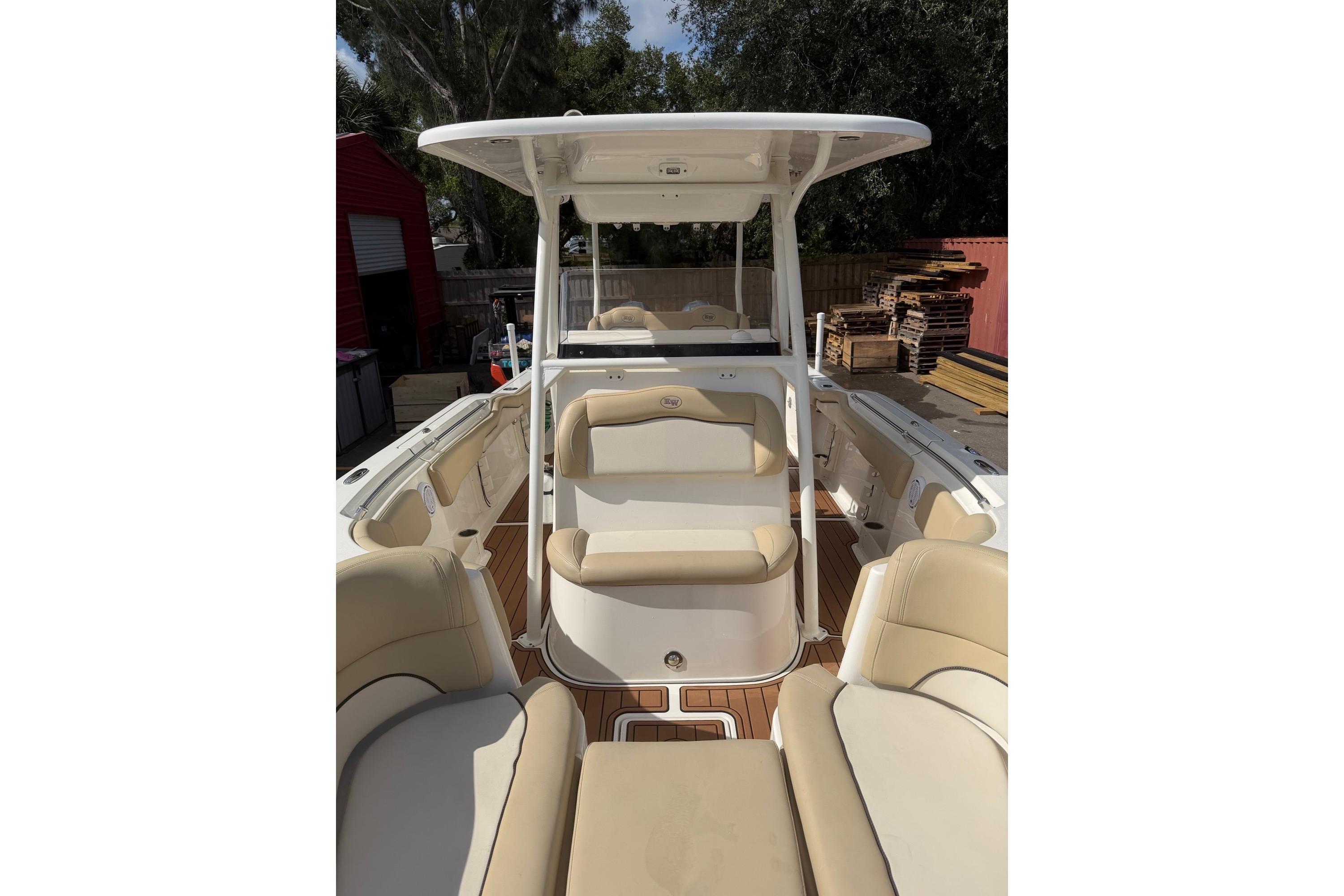 2019 Key West 263 FS boat interior with beige seating and wood accents.