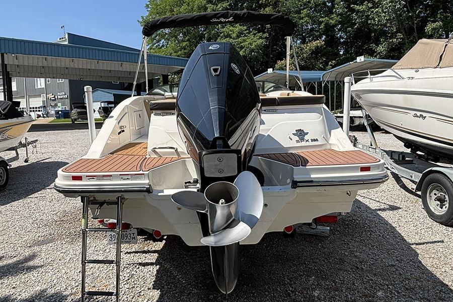 2019 Sea Ray SPX 230 Outboard boat with powerful engine, parked outdoors.