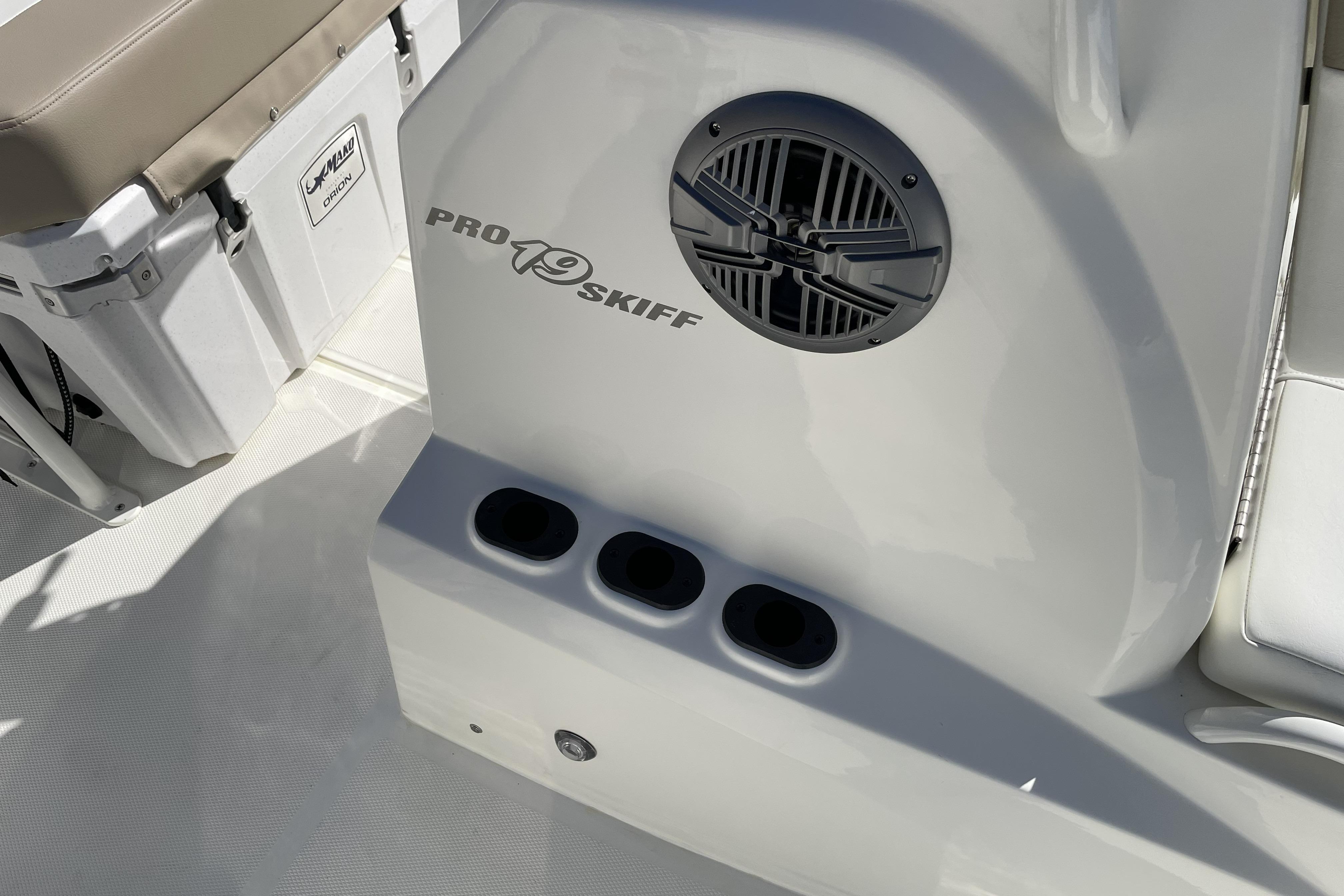 2026 Mako Pro Skiff 19 CC boat interior with speaker and storage compartments.