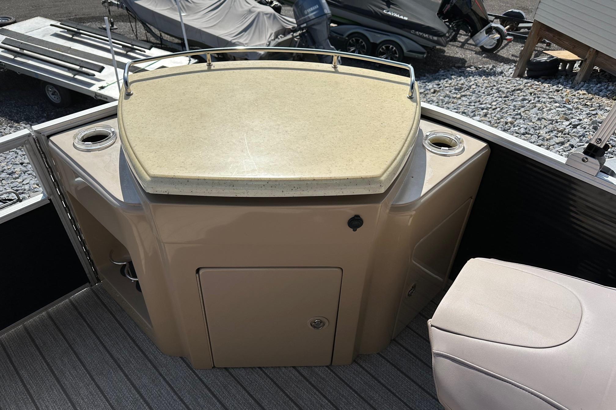 2017 Bennington 22 GPD boat interior with beige console and seating area.