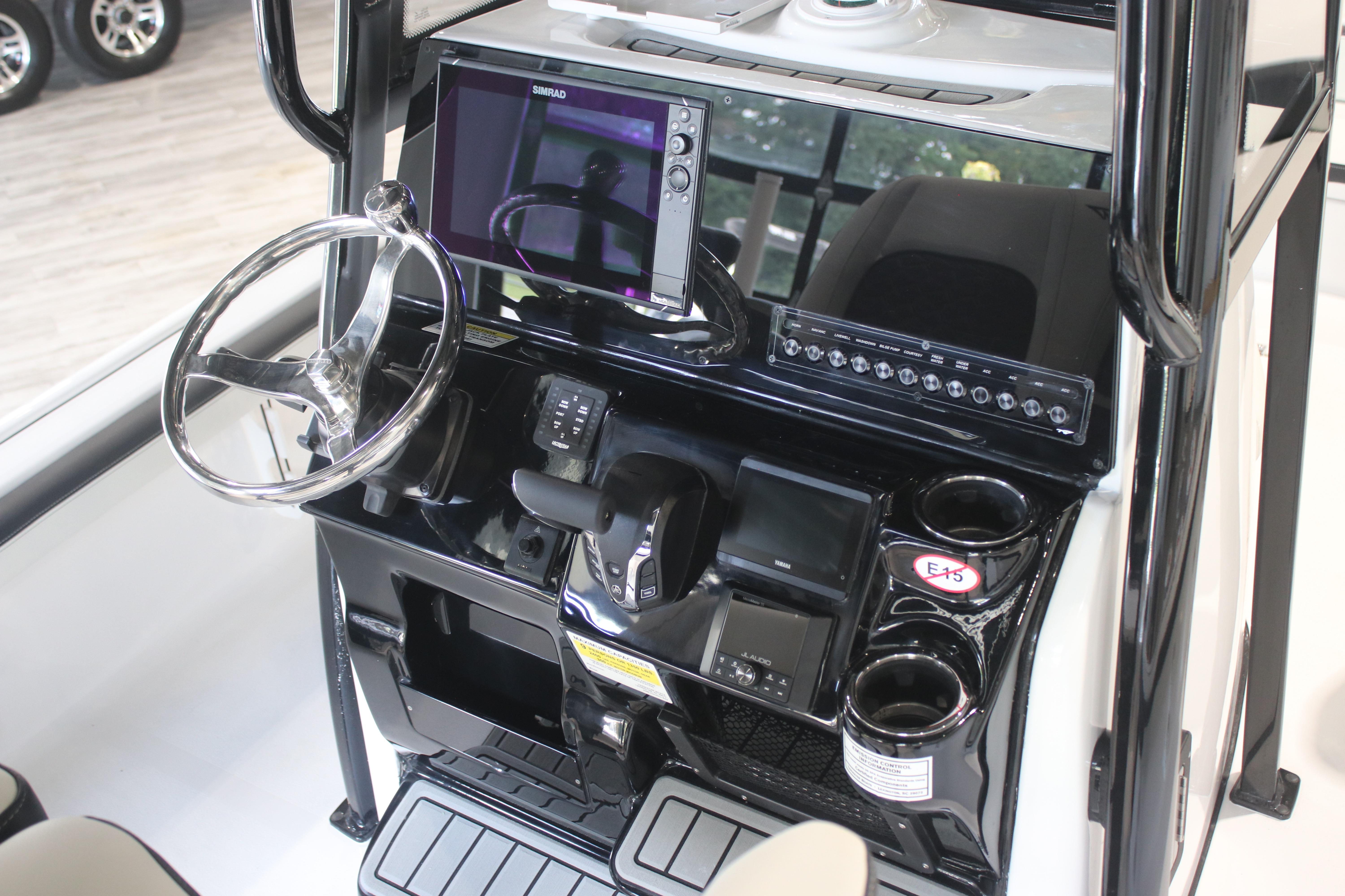 2026 Tidewater 2300 Carolina Bay boat console with steering wheel and electronic controls.