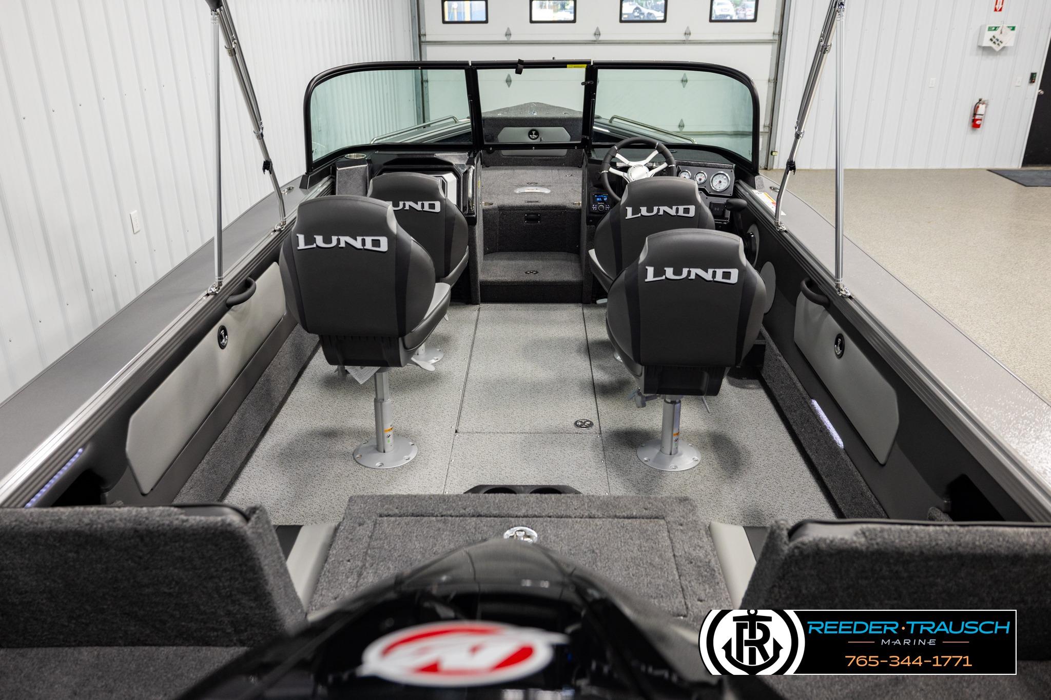 Interior view of a 2026 Lund 1975 Tyee boat with four seats and steering console.