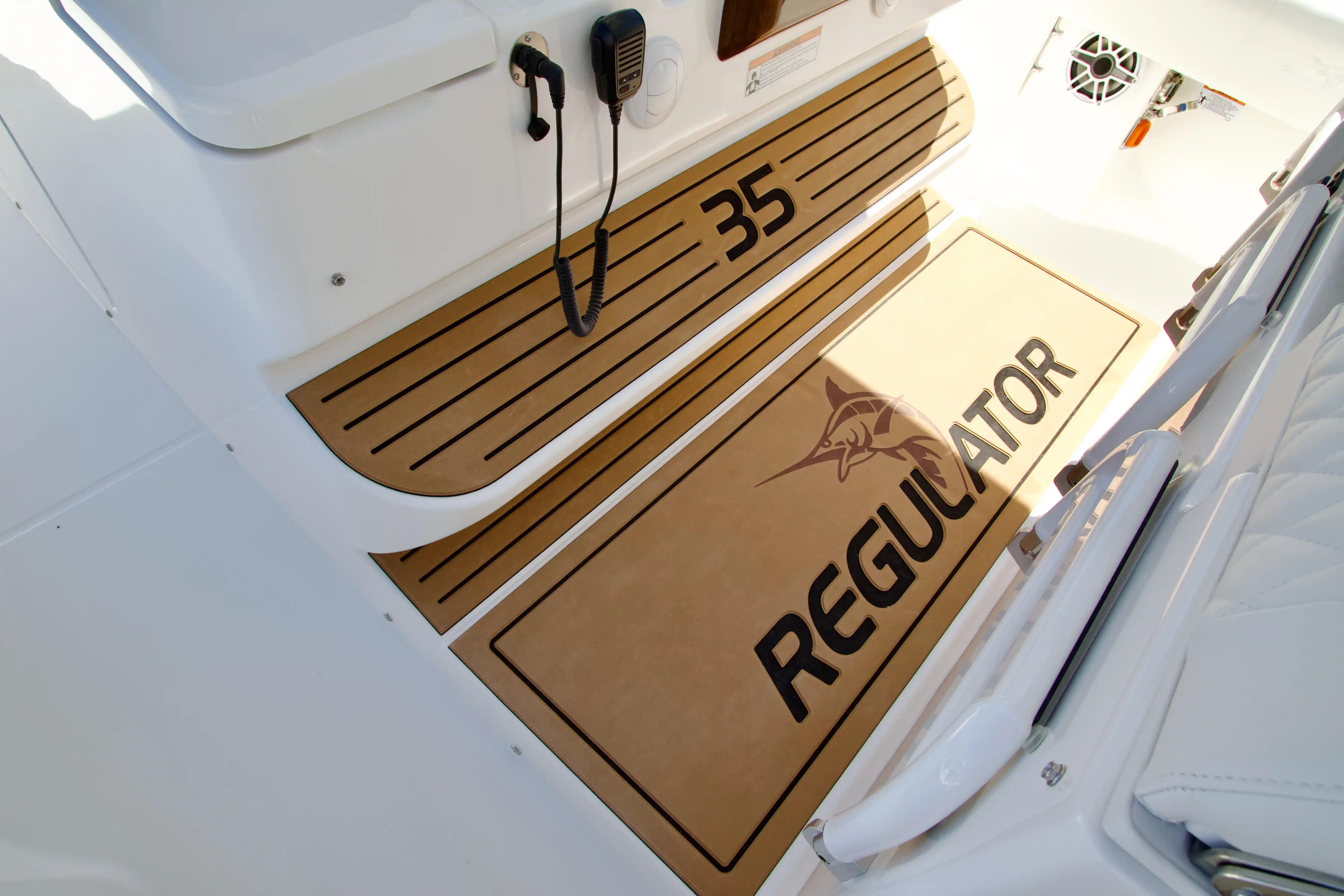 2027 Regulator 35 boat interior with branded flooring and communication equipment.
