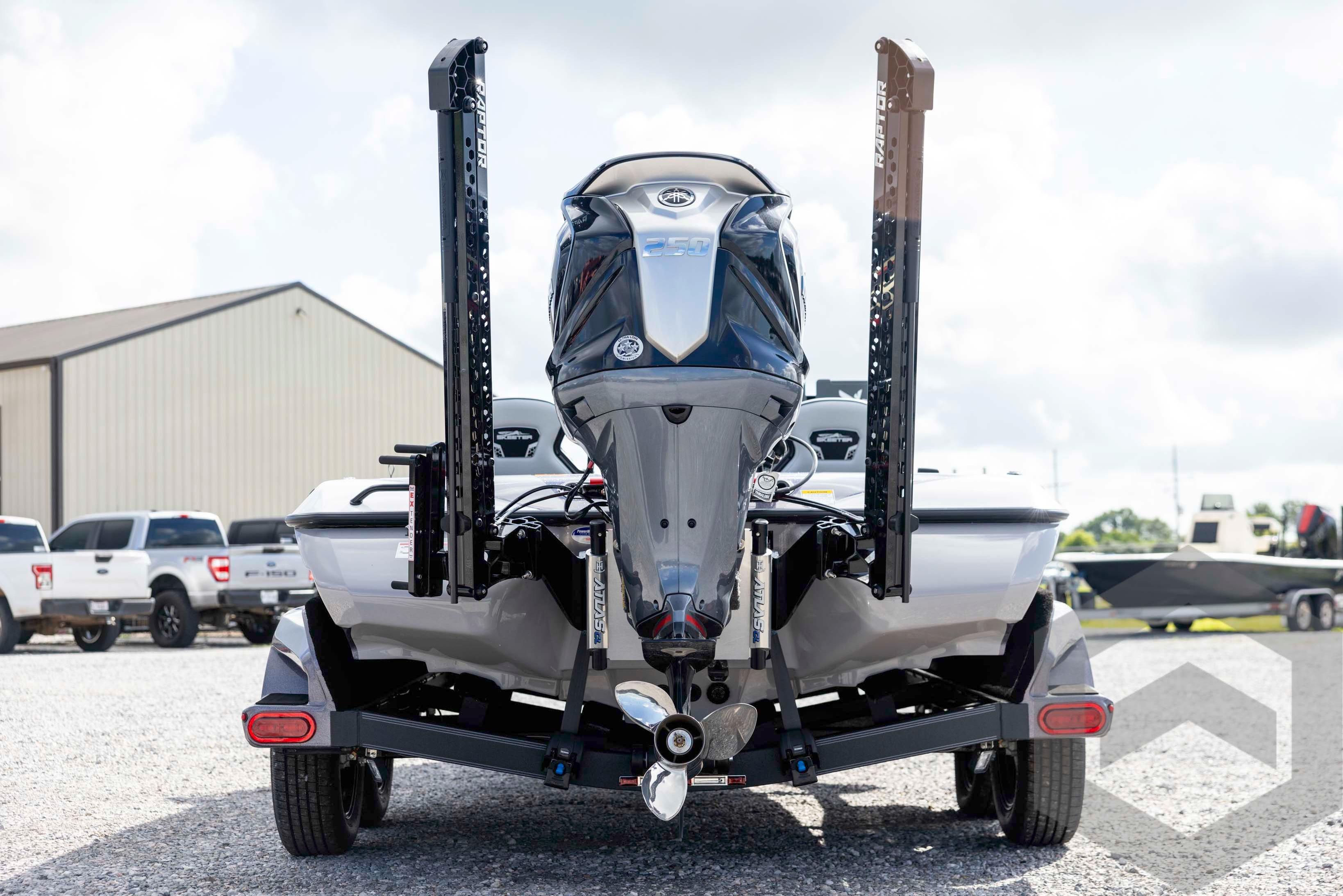 2026 Skeeter FXR20 FLEX boat with powerful outboard motor, parked on gravel.
