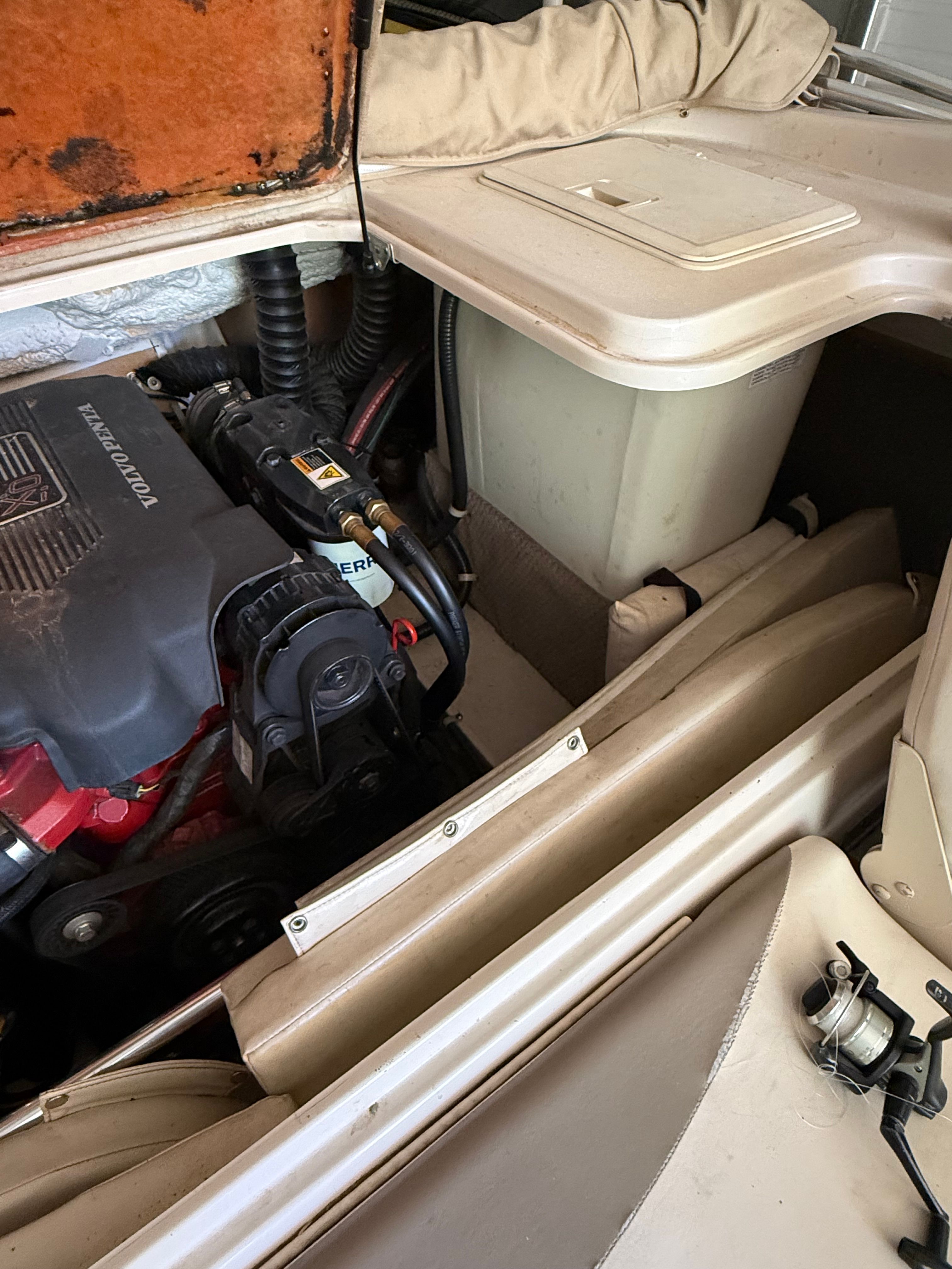 Engine compartment of a 2002 Glastron GX 205 Ski & Fish boat.
