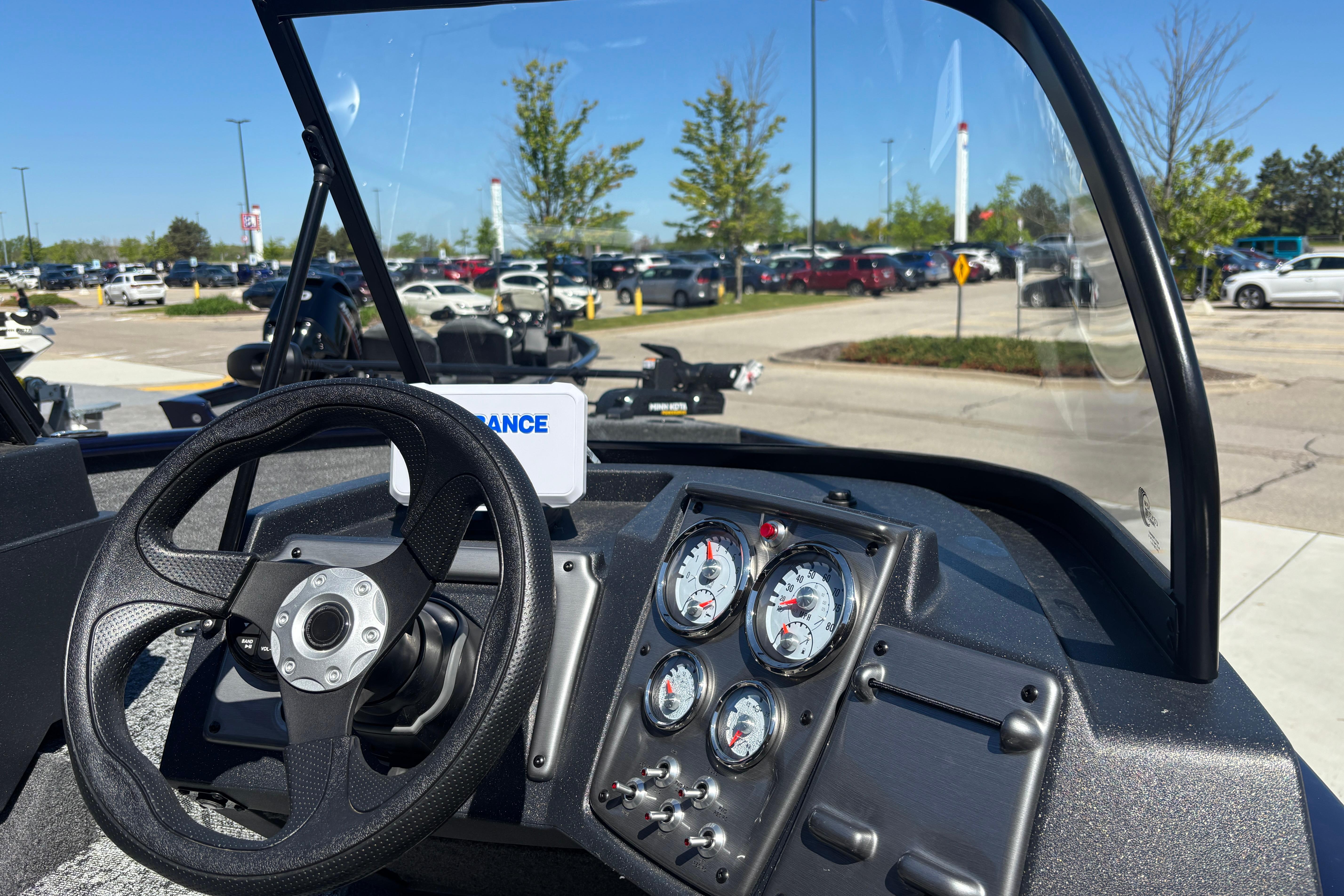 2026 Tracker Pro Guide V-175 WT boat dashboard with steering wheel and gauges.