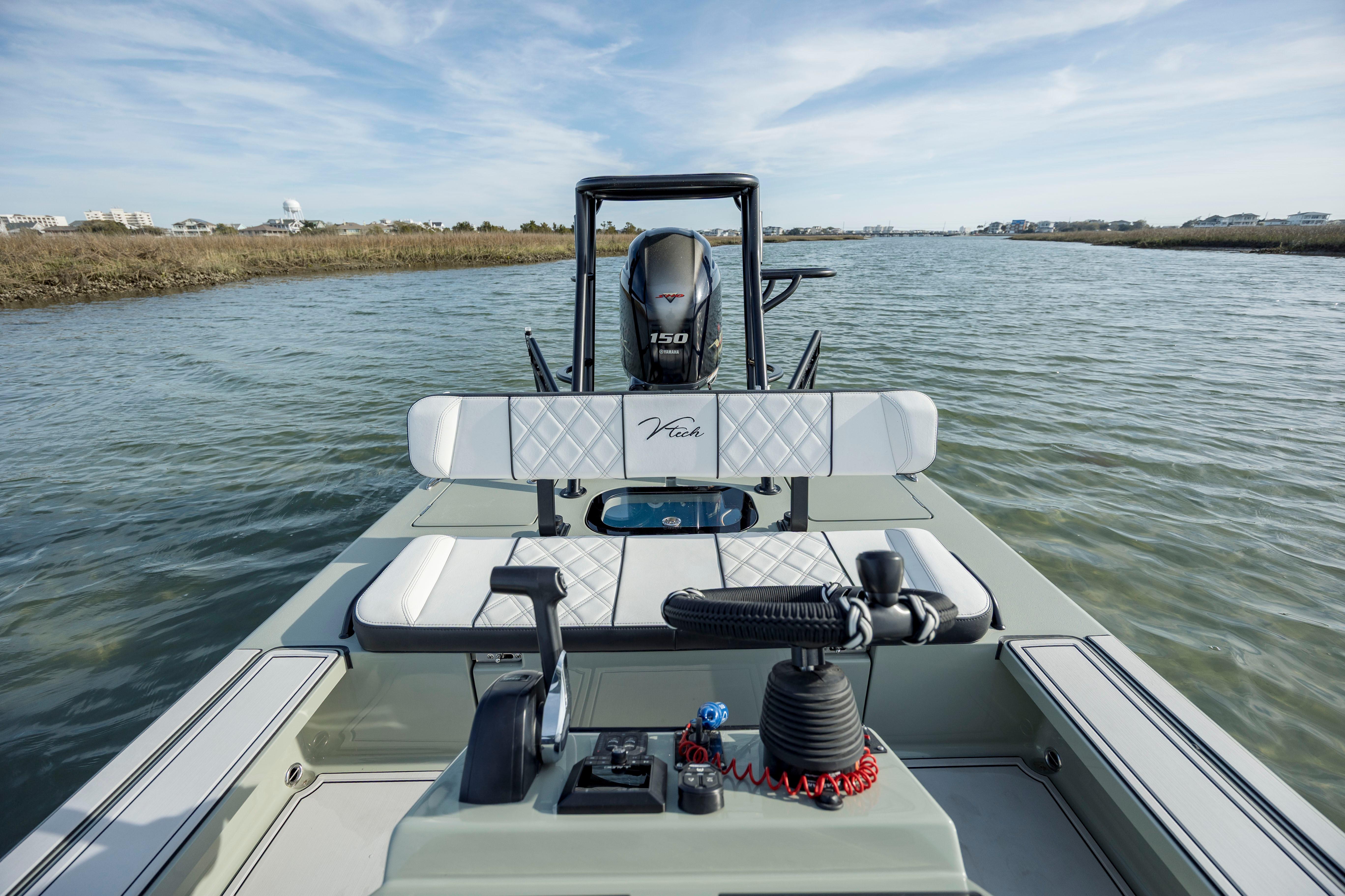 Vtech 18 boat, 2025 model, on calm water with modern seating and engine.
