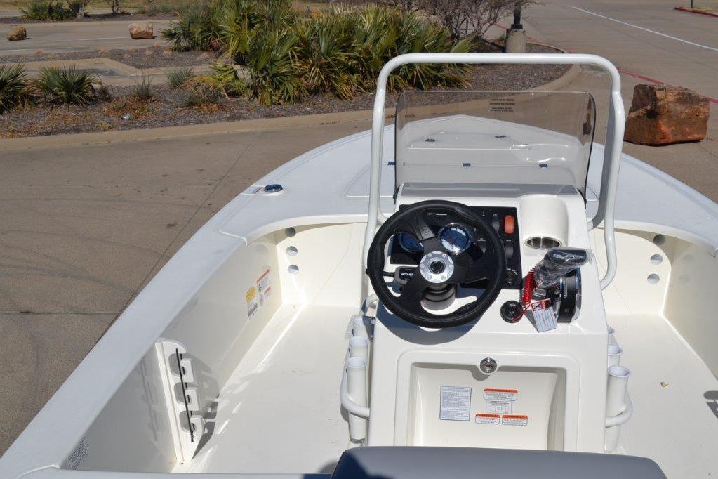 2026 Mako 18 Pro Skiff boat interior with steering wheel and console.