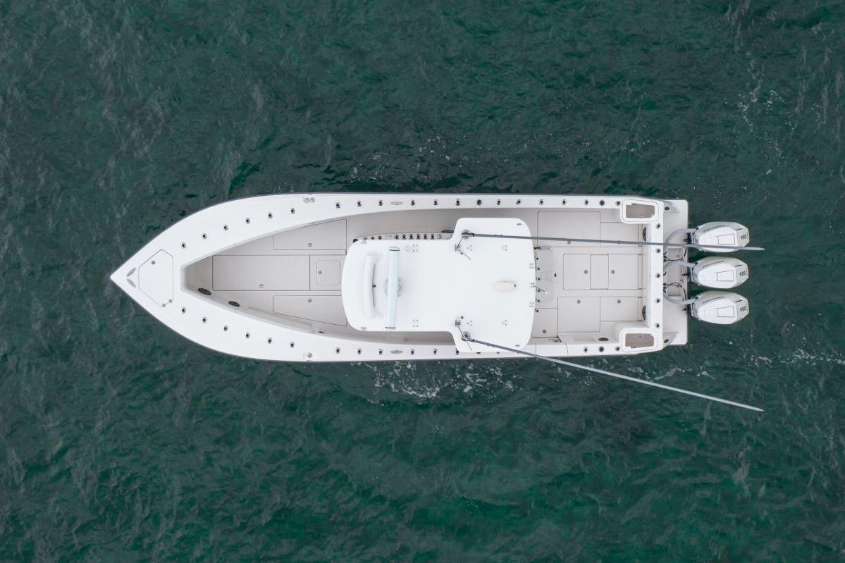 Overhead view of 2024 SeaVee 370Z boat on water, featuring triple outboard engines.
