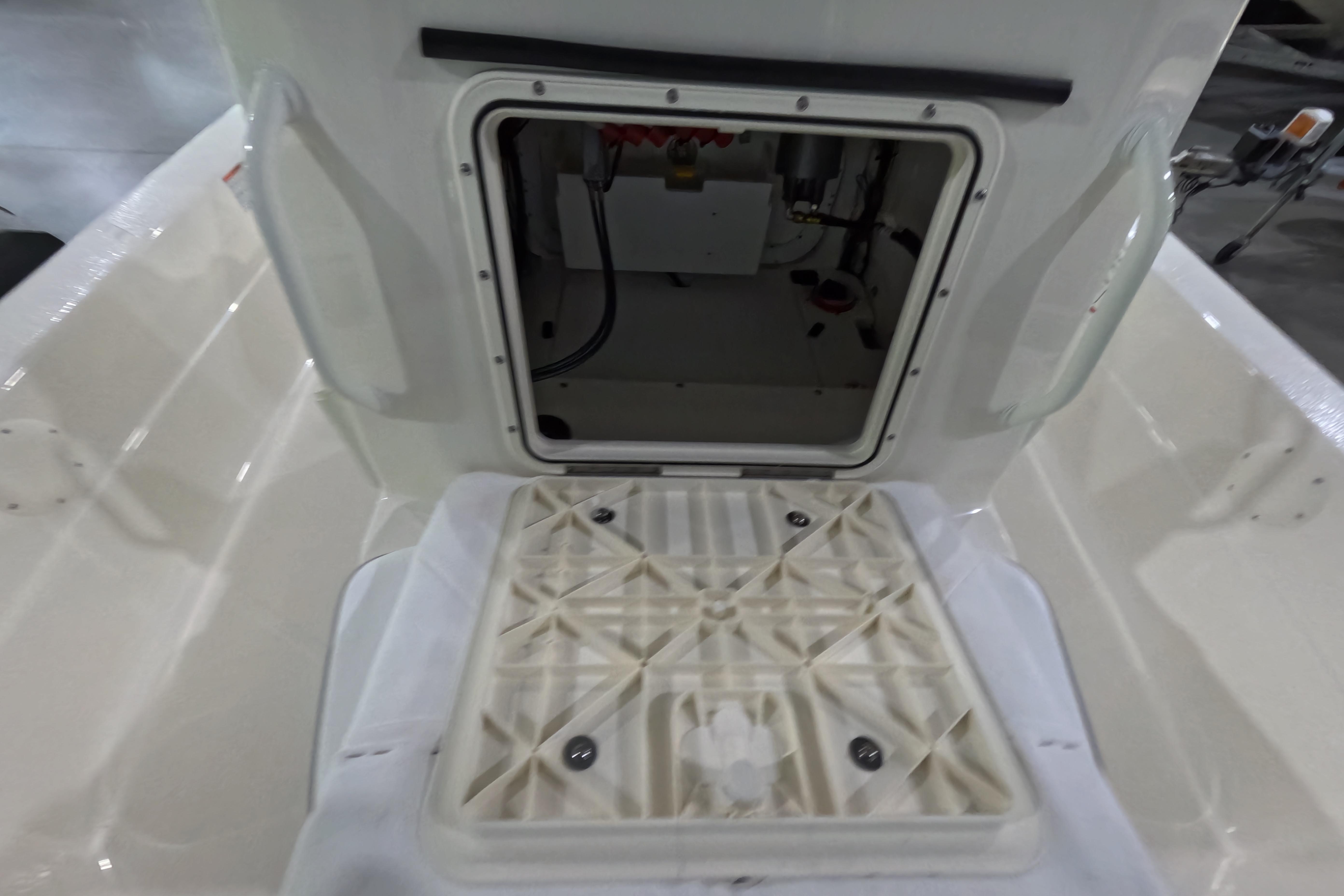 2026 Skeeter SX221 boat storage compartment with open hatch, showcasing interior details.