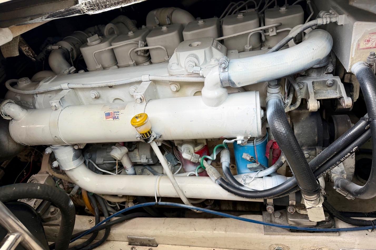 Engine compartment of a 2003 Tiara Yachts 3500 Open, showcasing detailed mechanical components.