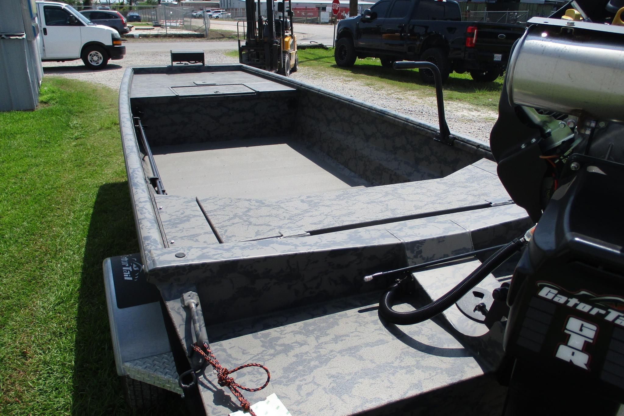 2026 Gator Tail 1754 Extreme boat with camo design, parked outdoors.
