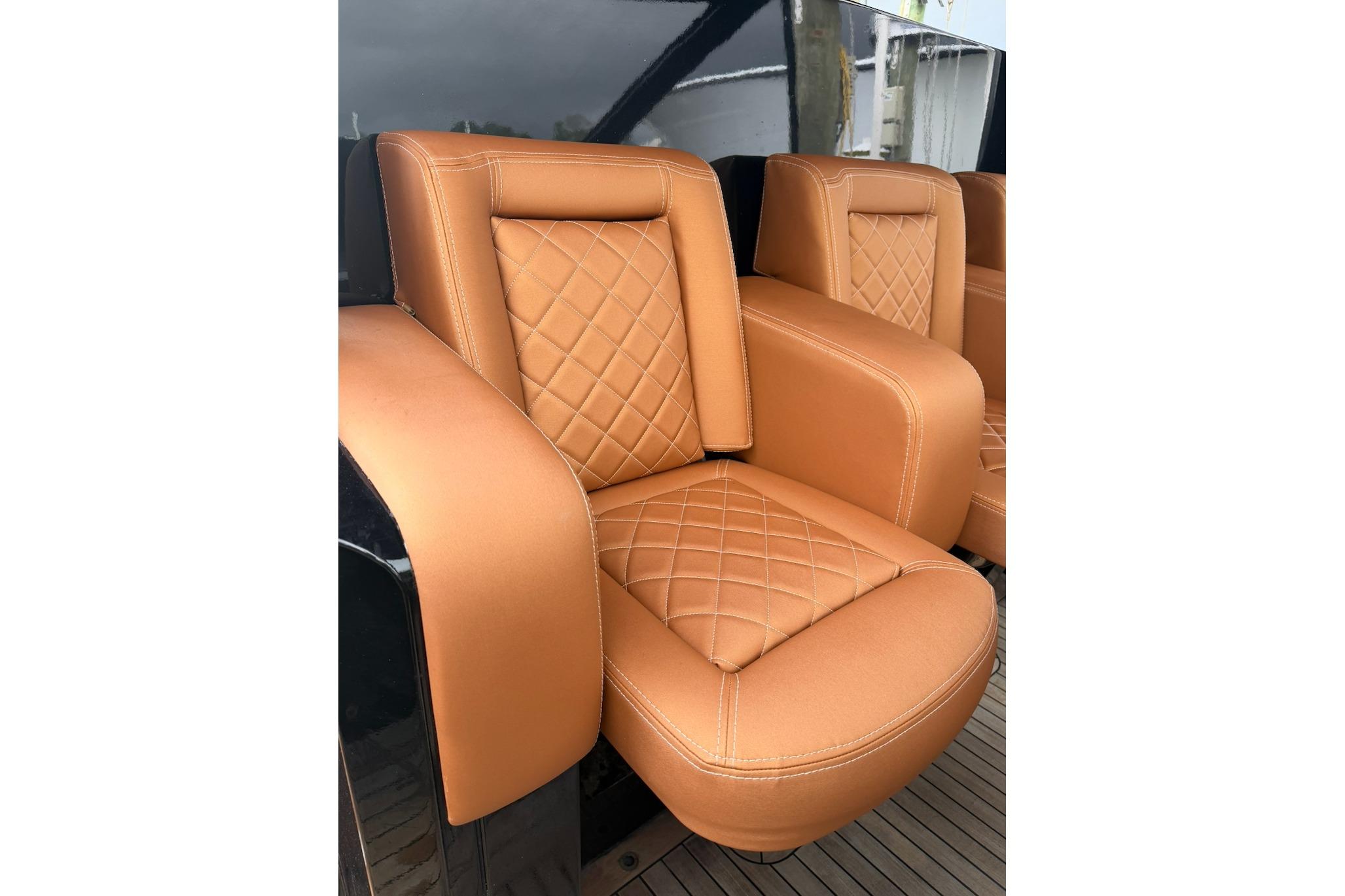 Luxurious tan leather seats on 2013 Windy SR52 yacht, featuring elegant diamond stitching.