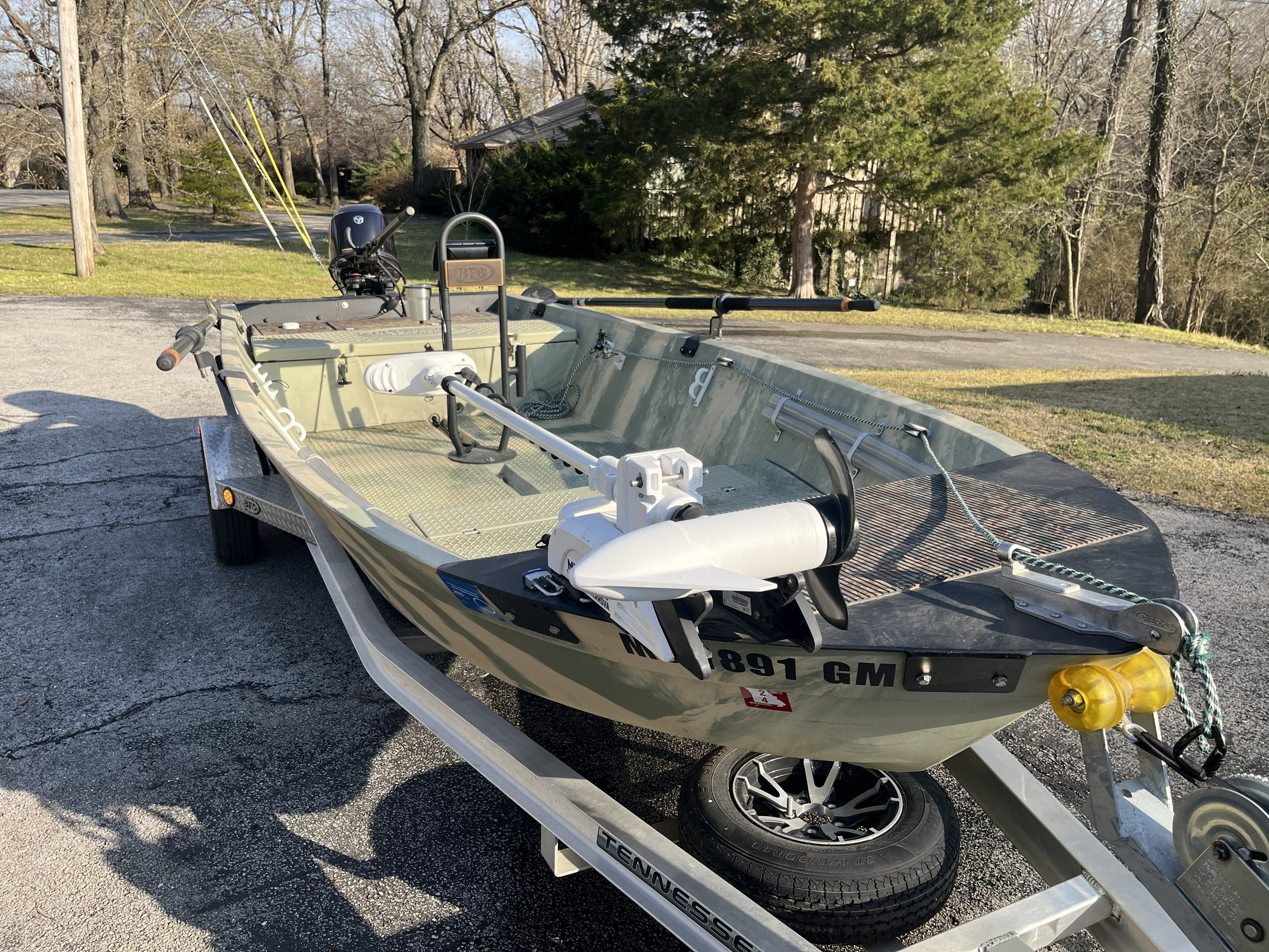 A 2020 Hog Island Boat Works SW 16 on a trailer, surrounded by trees.