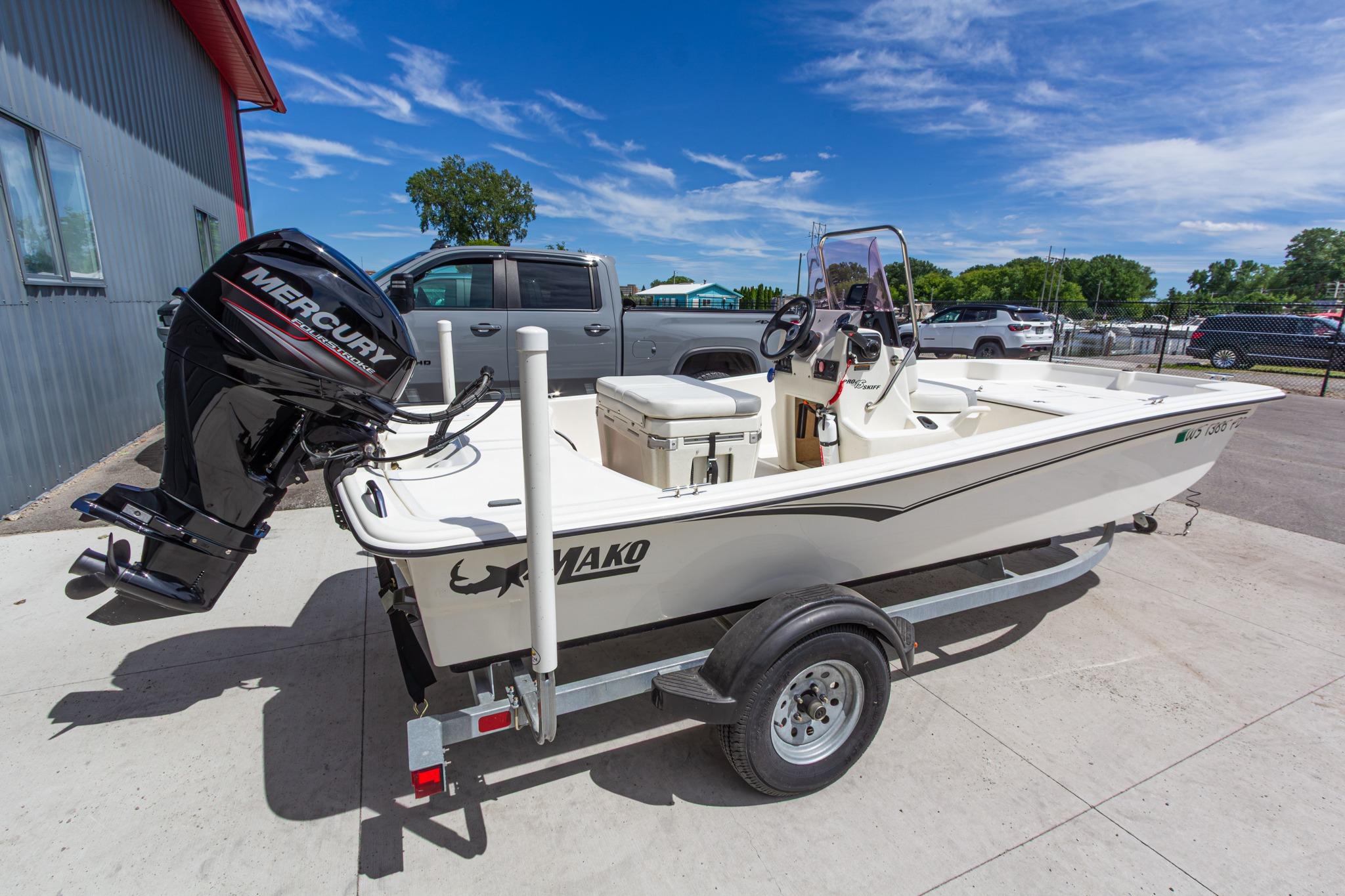 2020 Mako Pro Skiff 15 CC boat on trailer with Mercury outboard motor.