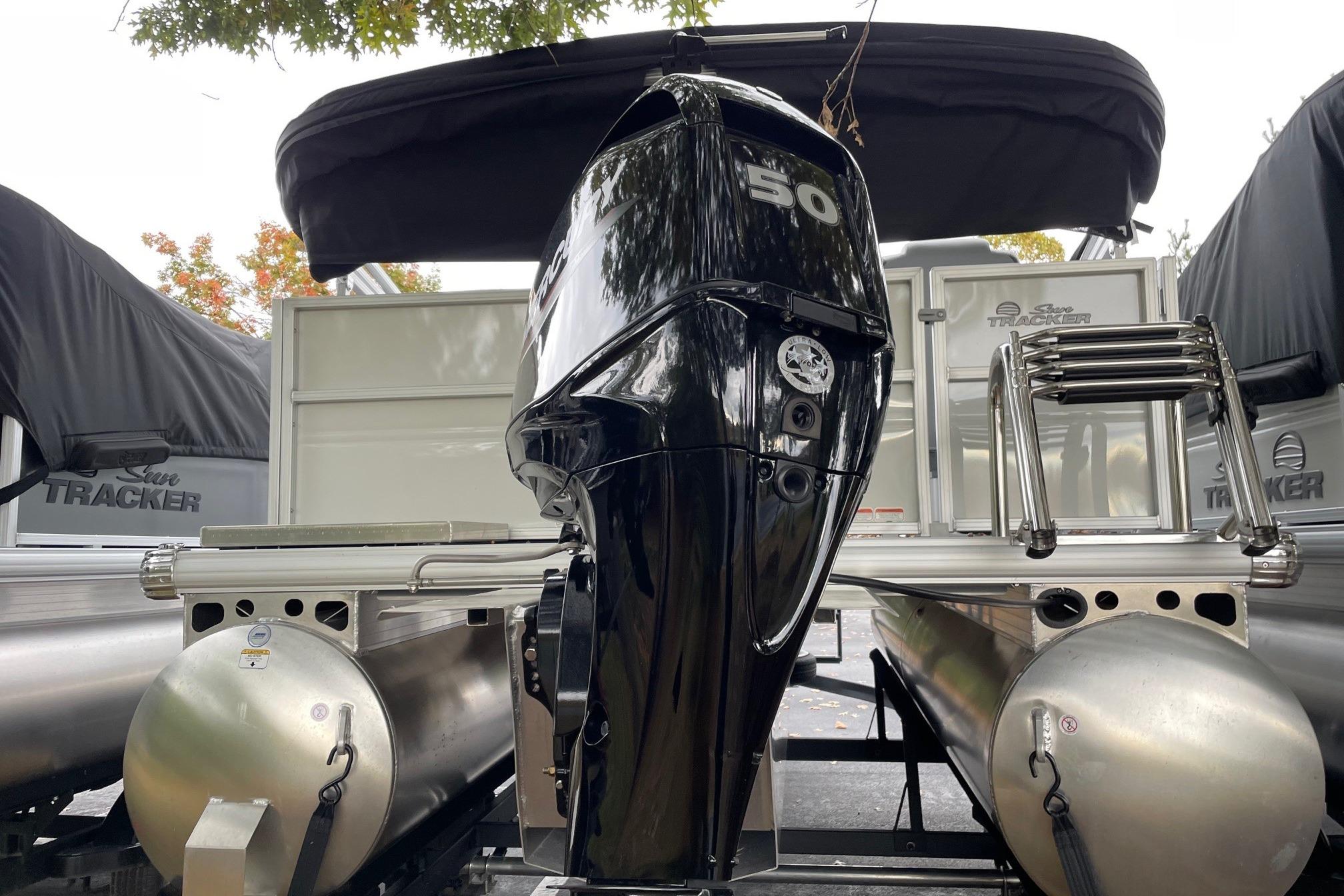 2026 Sun Tracker Party Barge 16 DLX with powerful 50 HP outboard motor.