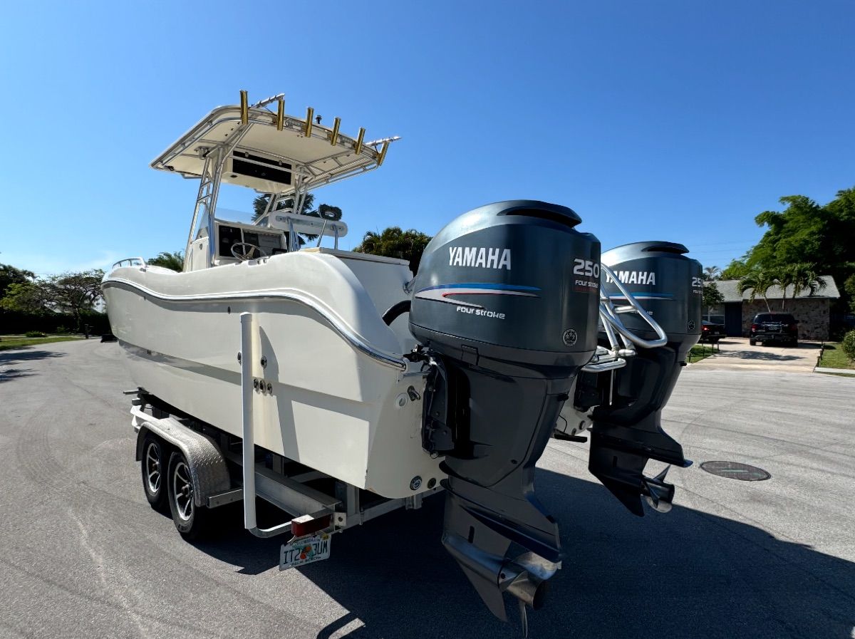 2004 World Cat 270TE boat with Yamaha engines on trailer.