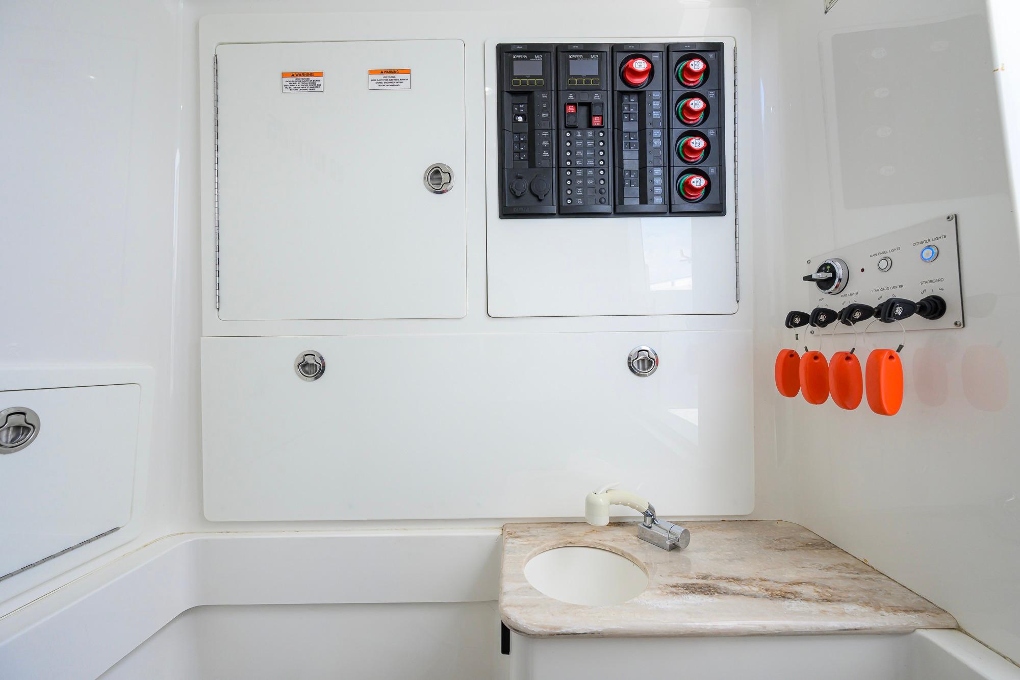 Control panel and sink area inside 2020 Valhalla Boatworks V-41 boat cabin.
