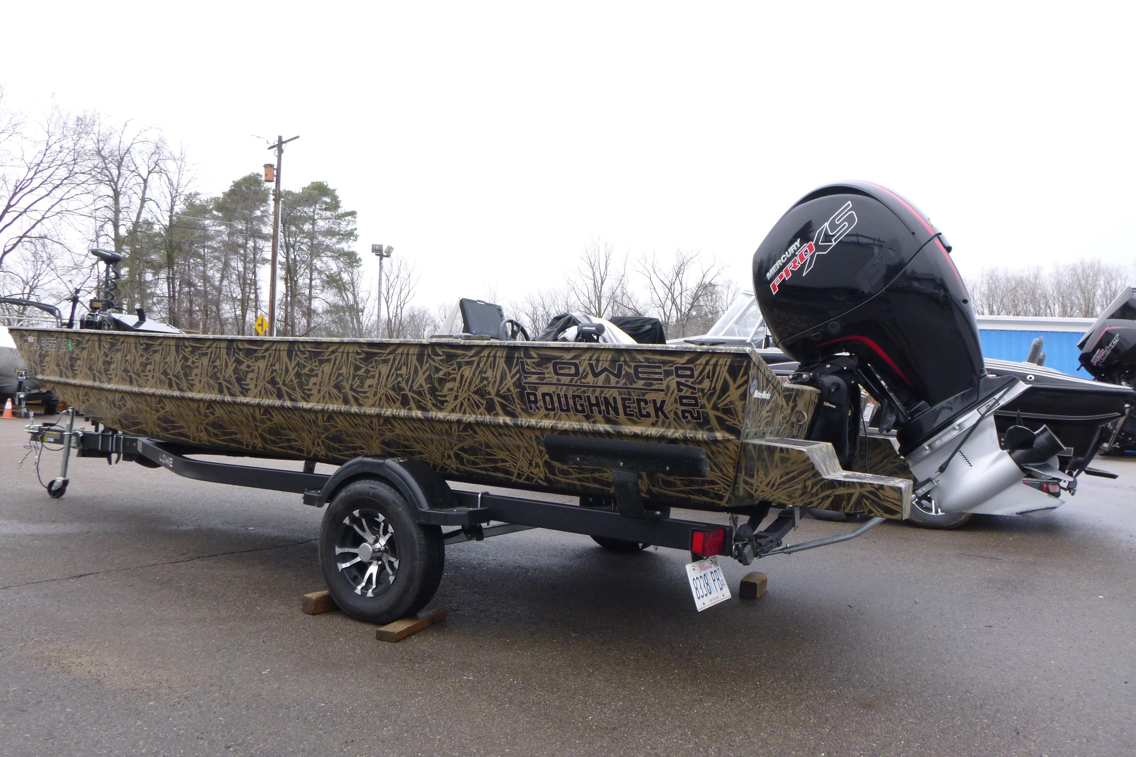 2024 Lowe Roughneck 2070 boat with camouflage design on a trailer, featuring a powerful outboard motor.