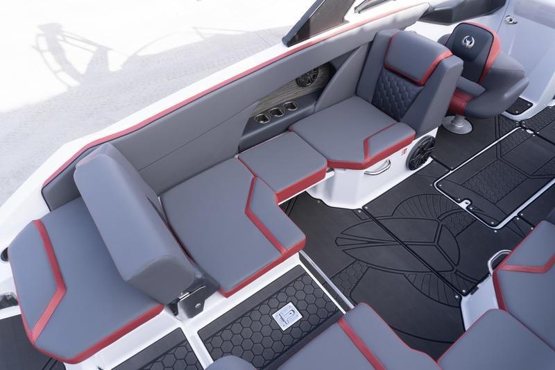 2026 Scarab 255 LX Wake boat interior with gray and red seating, modern design.
