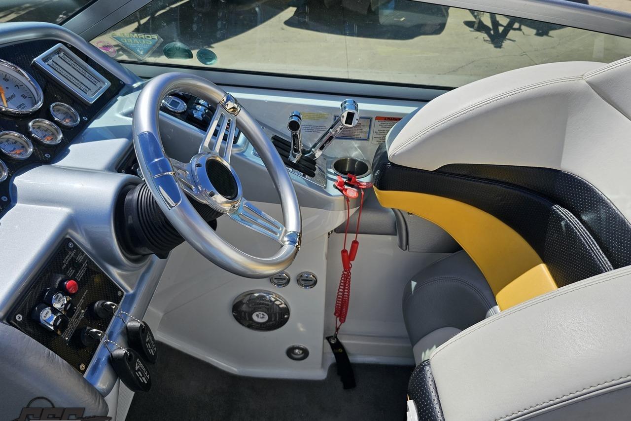 2014 Formula 292 FASTech boat cockpit with steering wheel and control panel.