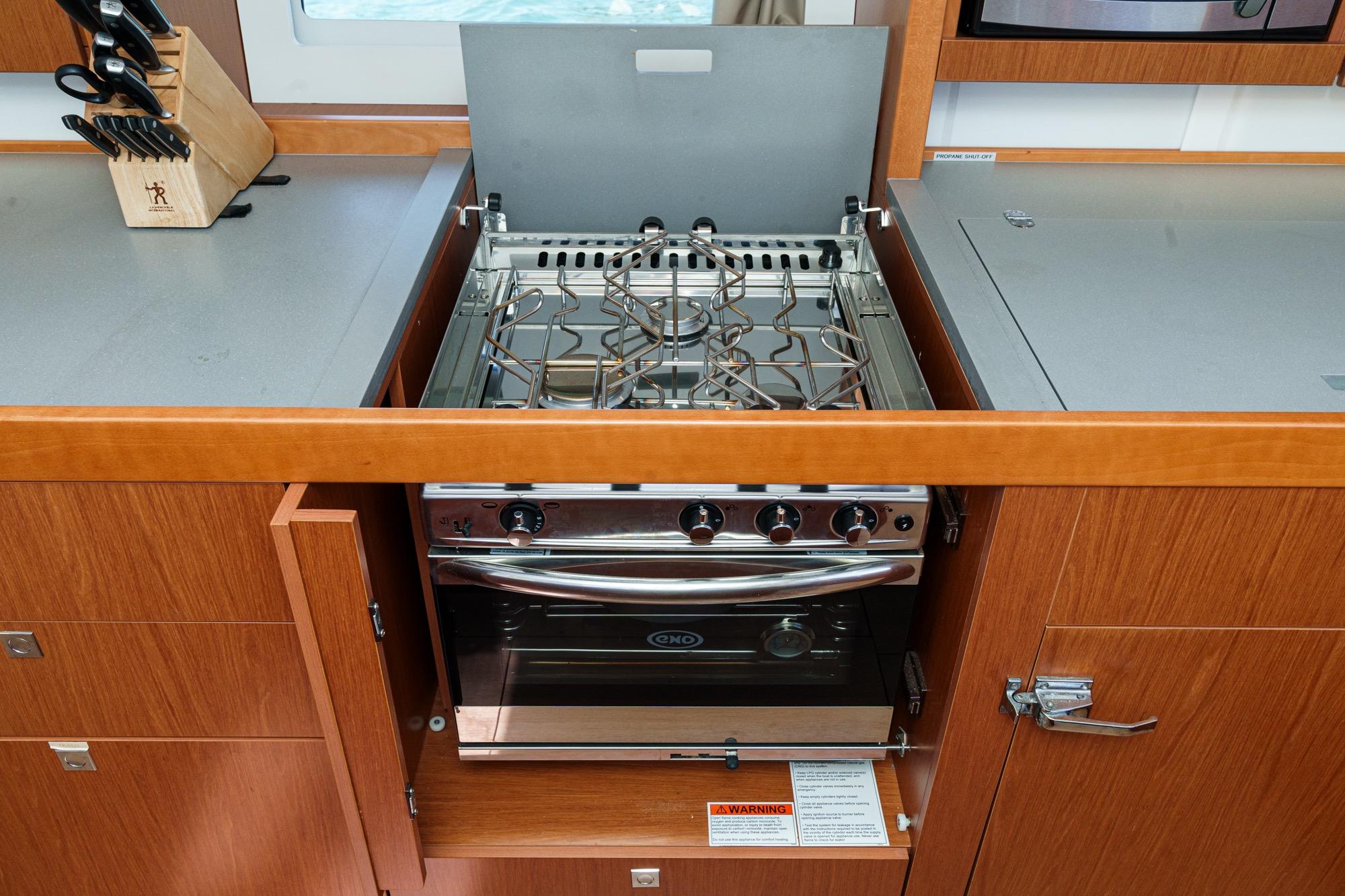 Modern kitchen stove in 2017 Beneteau Sense 50 yacht galley.