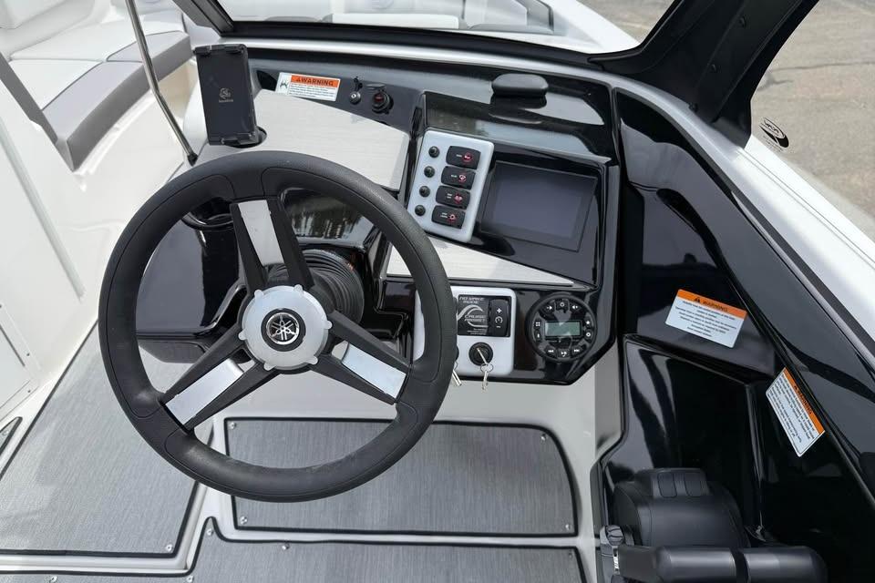 2026 Yamaha Boats AR220 dashboard with steering wheel and control panel.