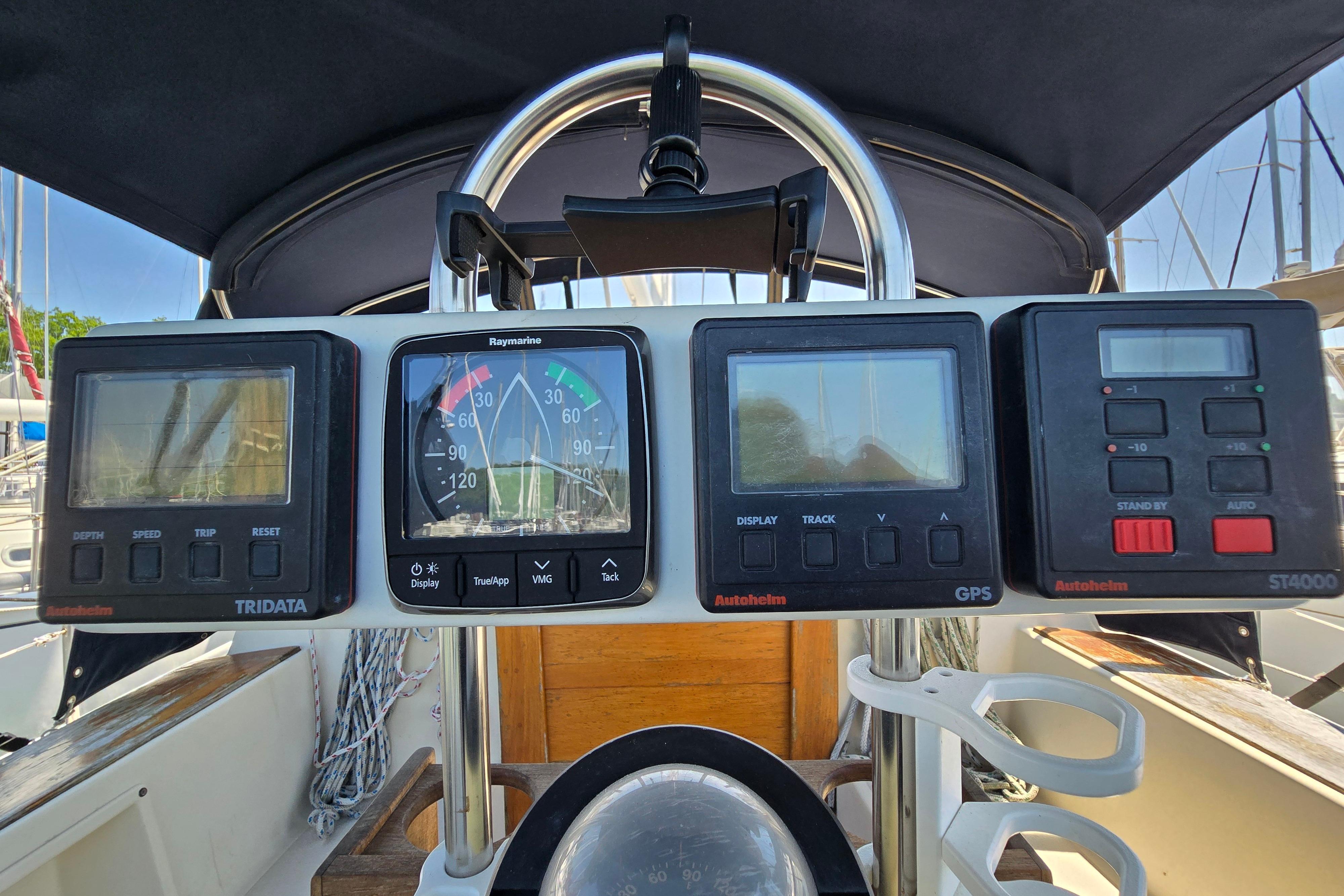 Cockpit instruments on a 1993 Caliber 35 sailboat, featuring navigation and control displays.