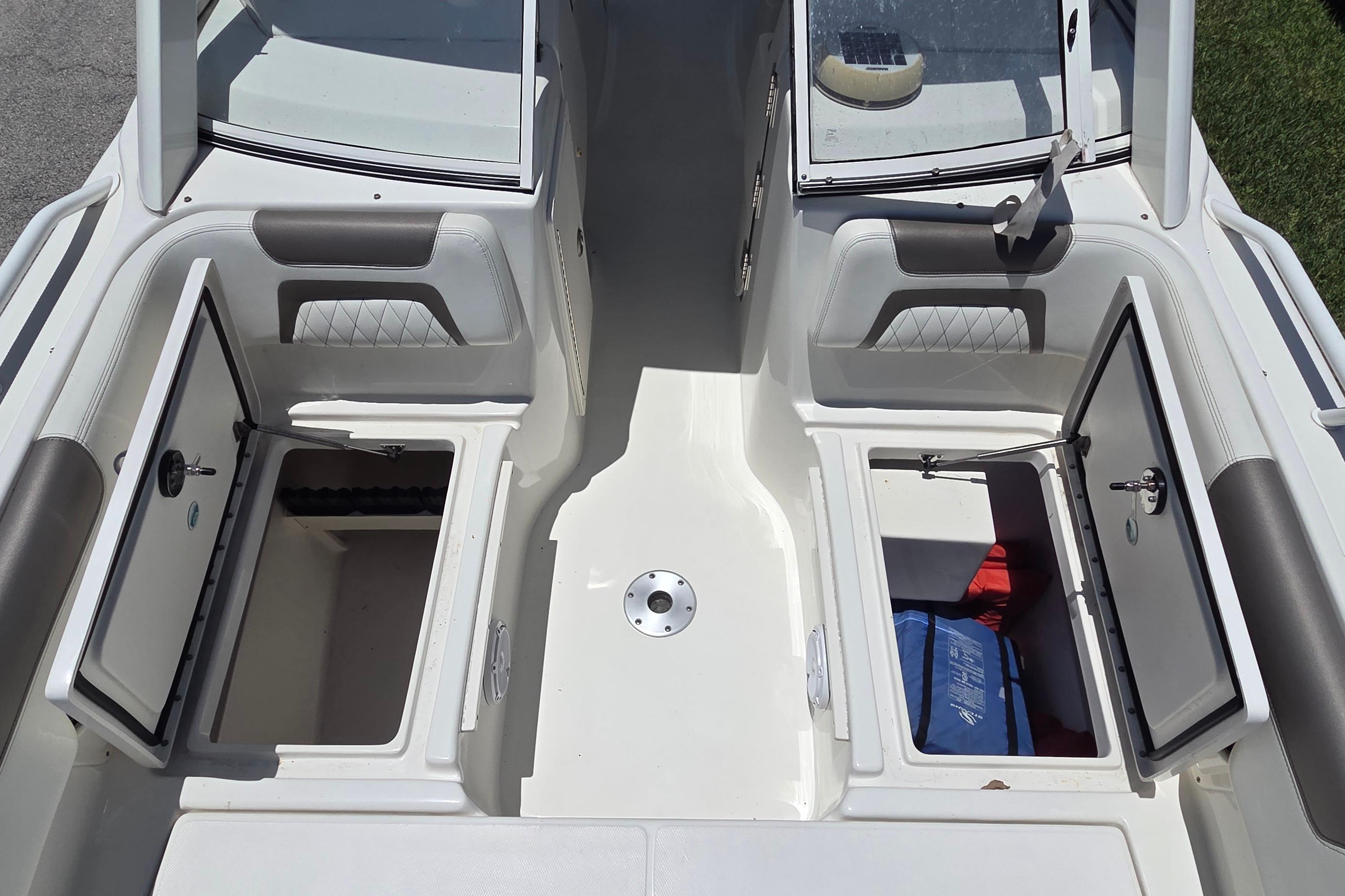 2022 World Cat 255 DC boat interior with open storage compartments.