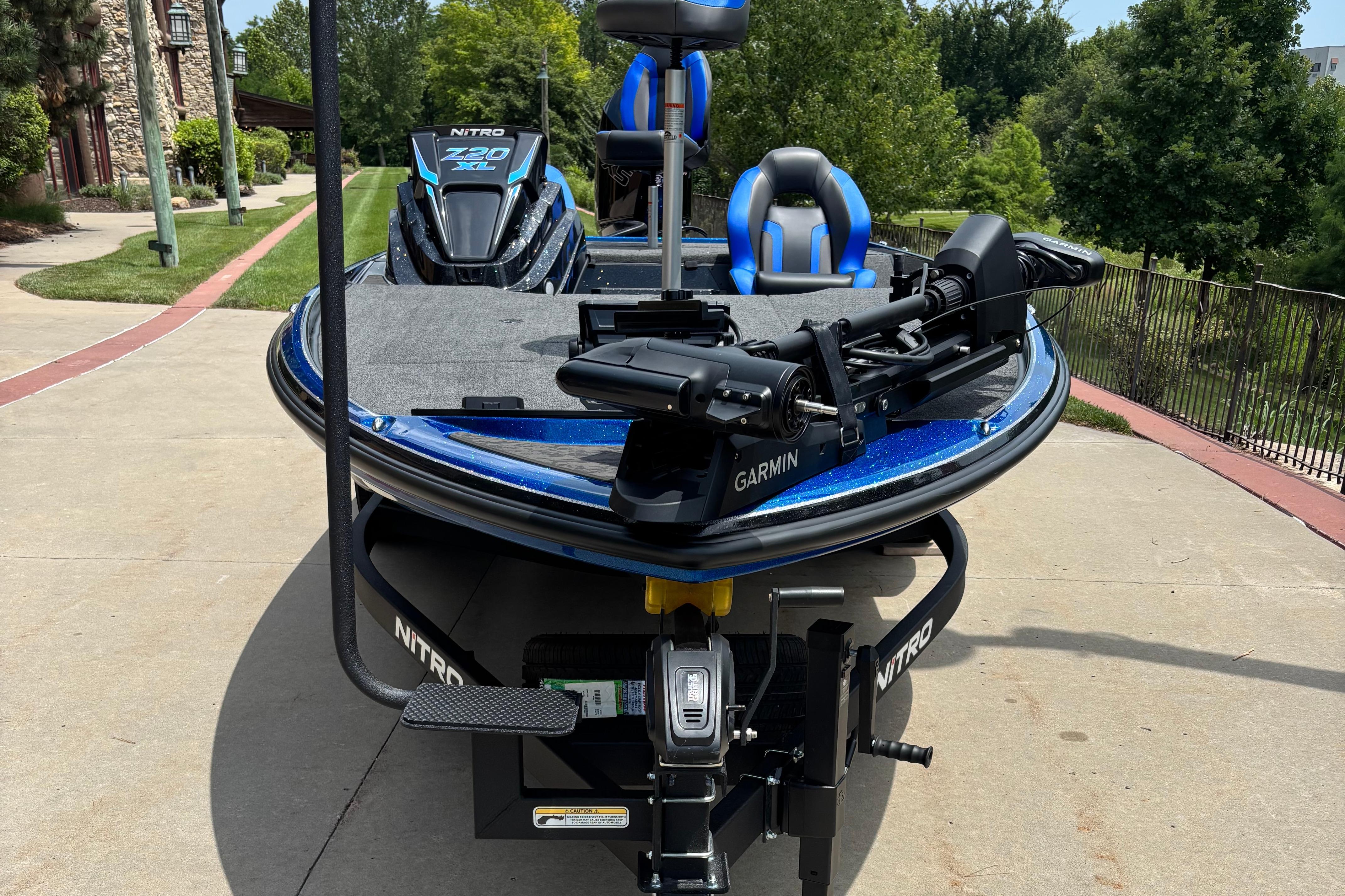 2026 Nitro Z20 XL Pro fishing boat with Garmin equipment, parked outdoors.
