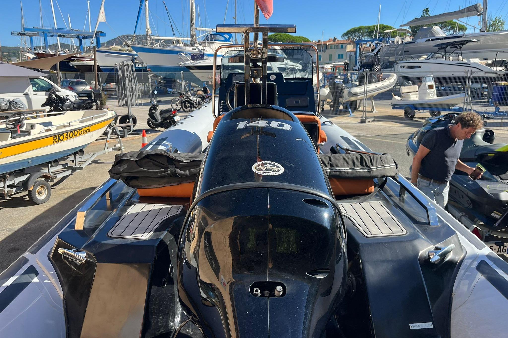 2022 Brig Eagle 6.7 boat in marina, surrounded by other vessels and equipment.