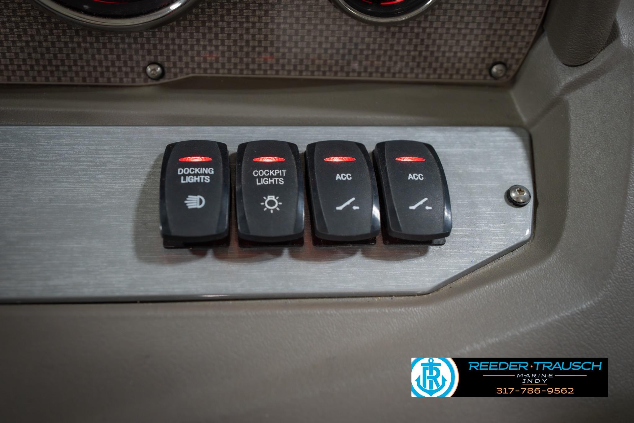 Control panel of a 2015 Regal 2000 ESX Bowrider with labeled switches.