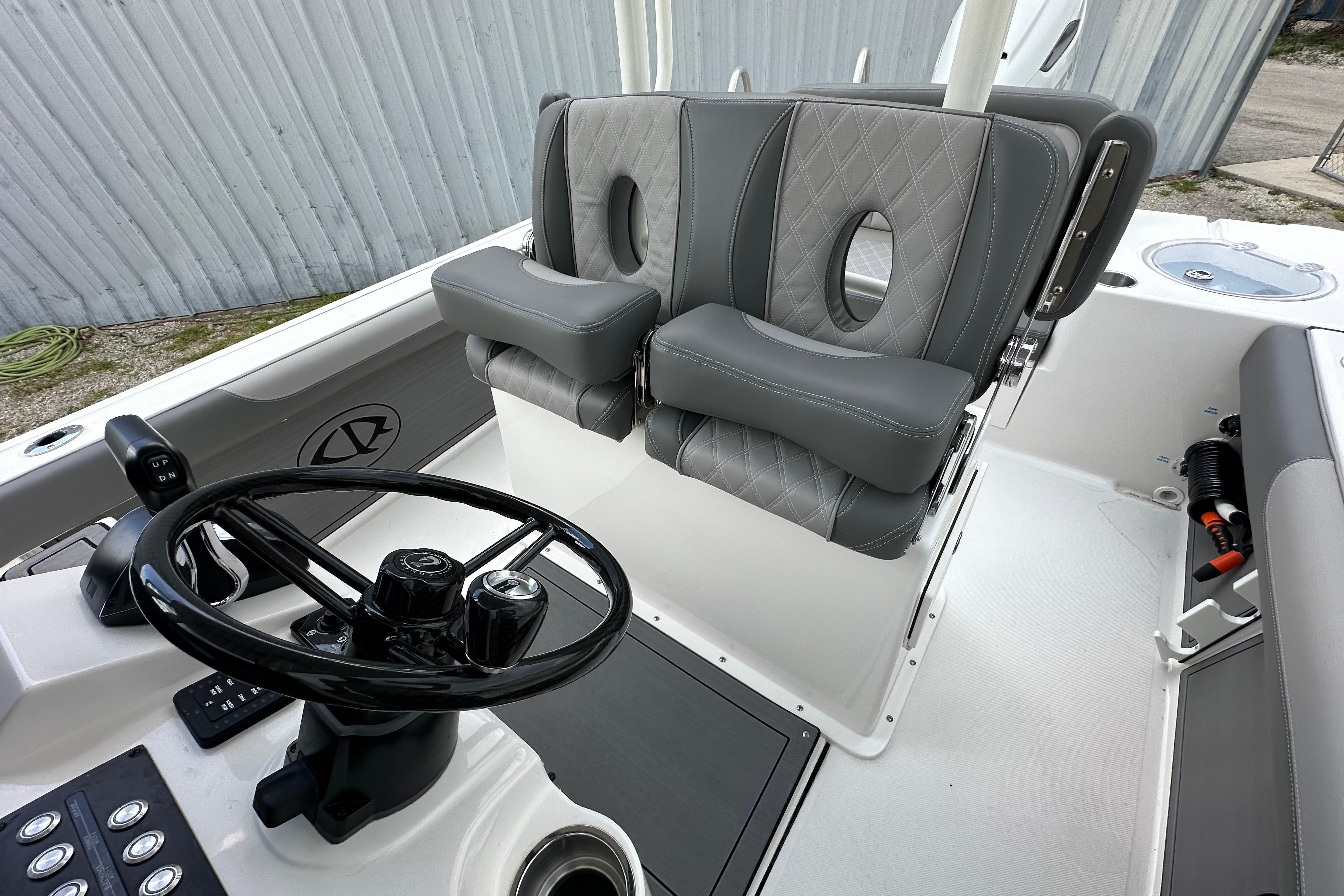 2027 Sea Born LX24 Center Console boat interior with steering wheel and cushioned seats.
