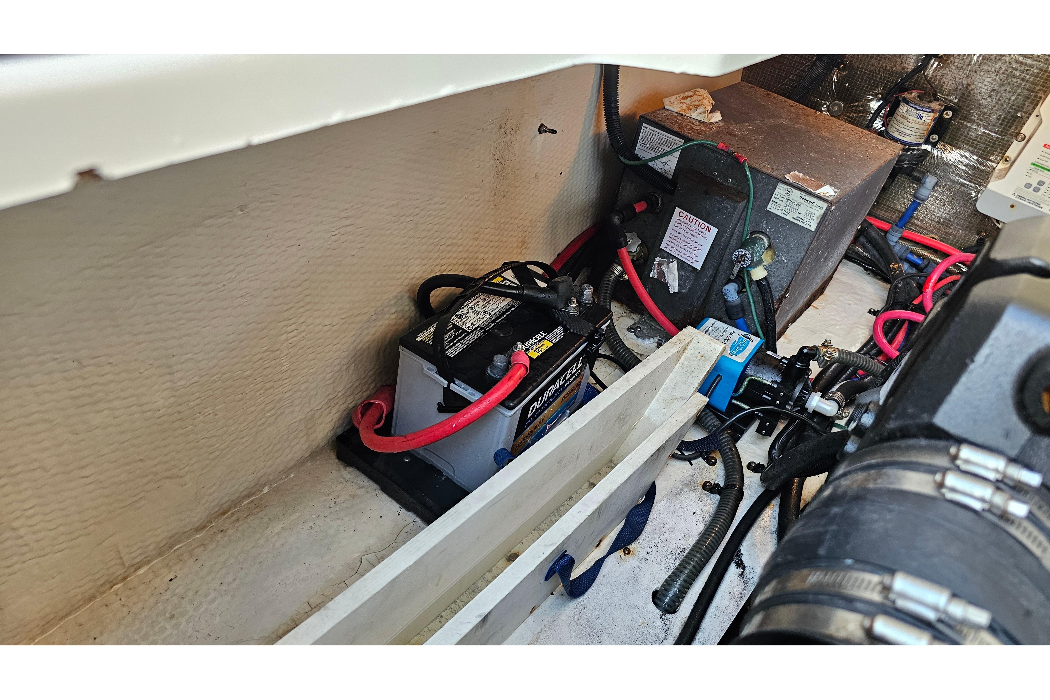 Engine compartment of a 2005 Regal 3060 Window Express with battery and wiring.