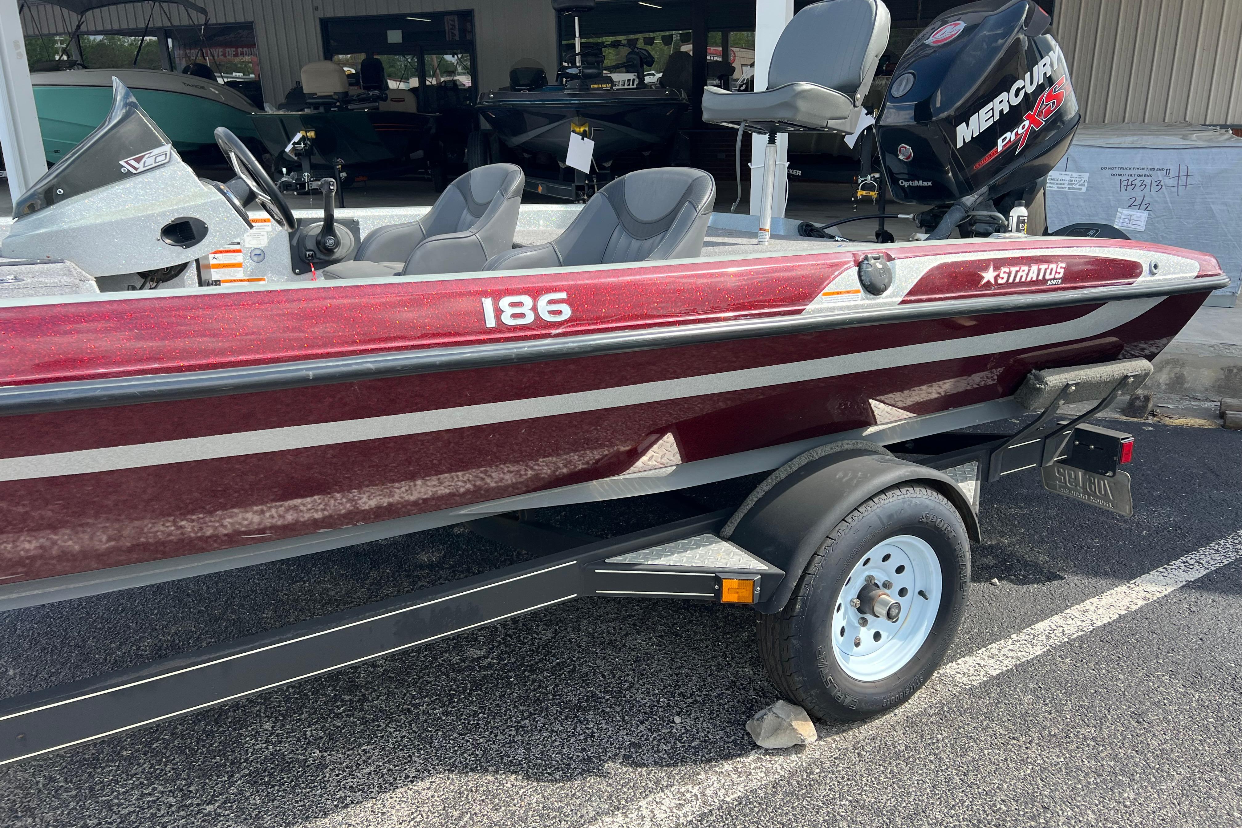 Red 2015 Stratos 186 VLO boat with Mercury Pro XS engine on trailer.