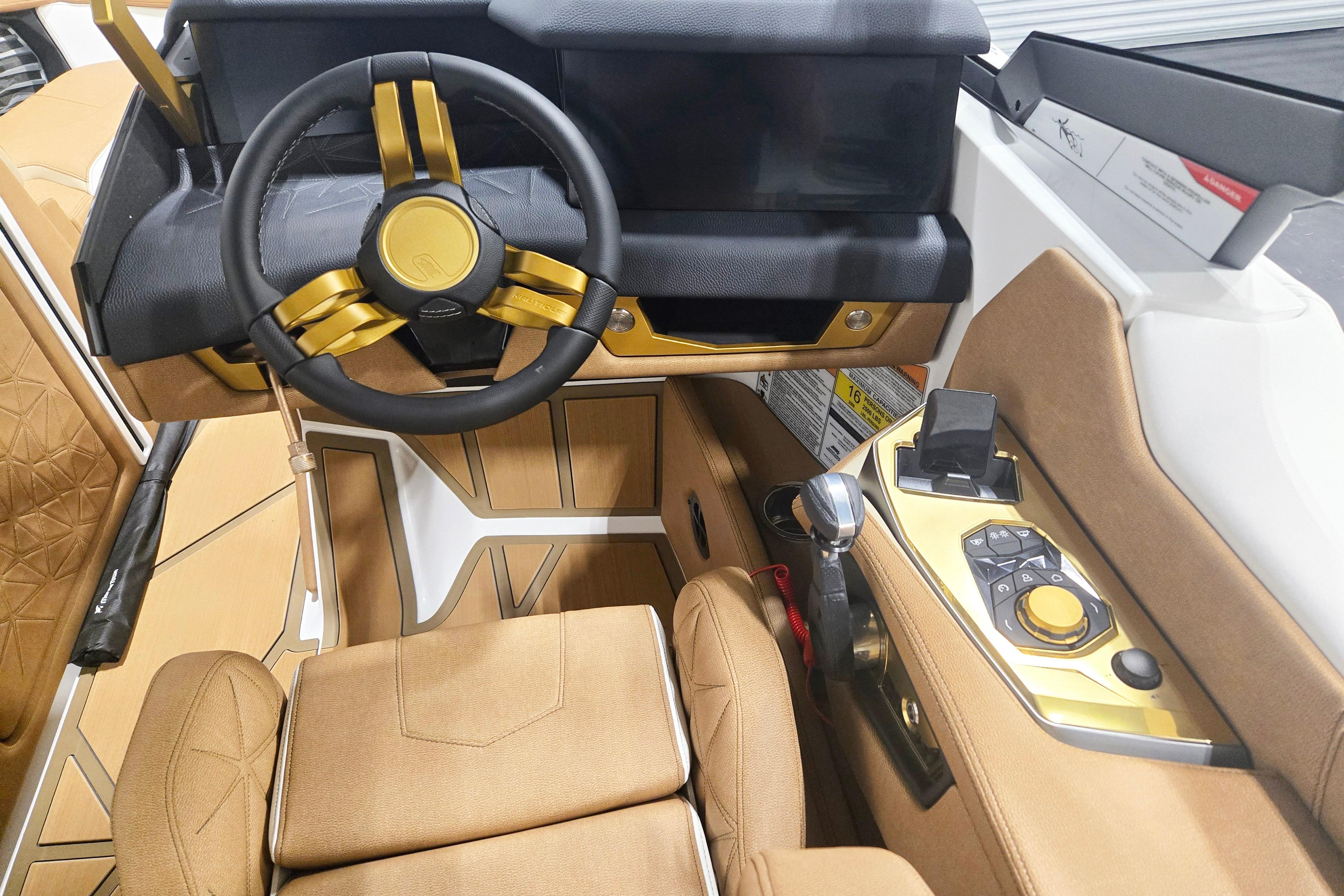 Interior of 2026 Nautique Super Air Nautique G23 Paragon with luxurious steering and controls.