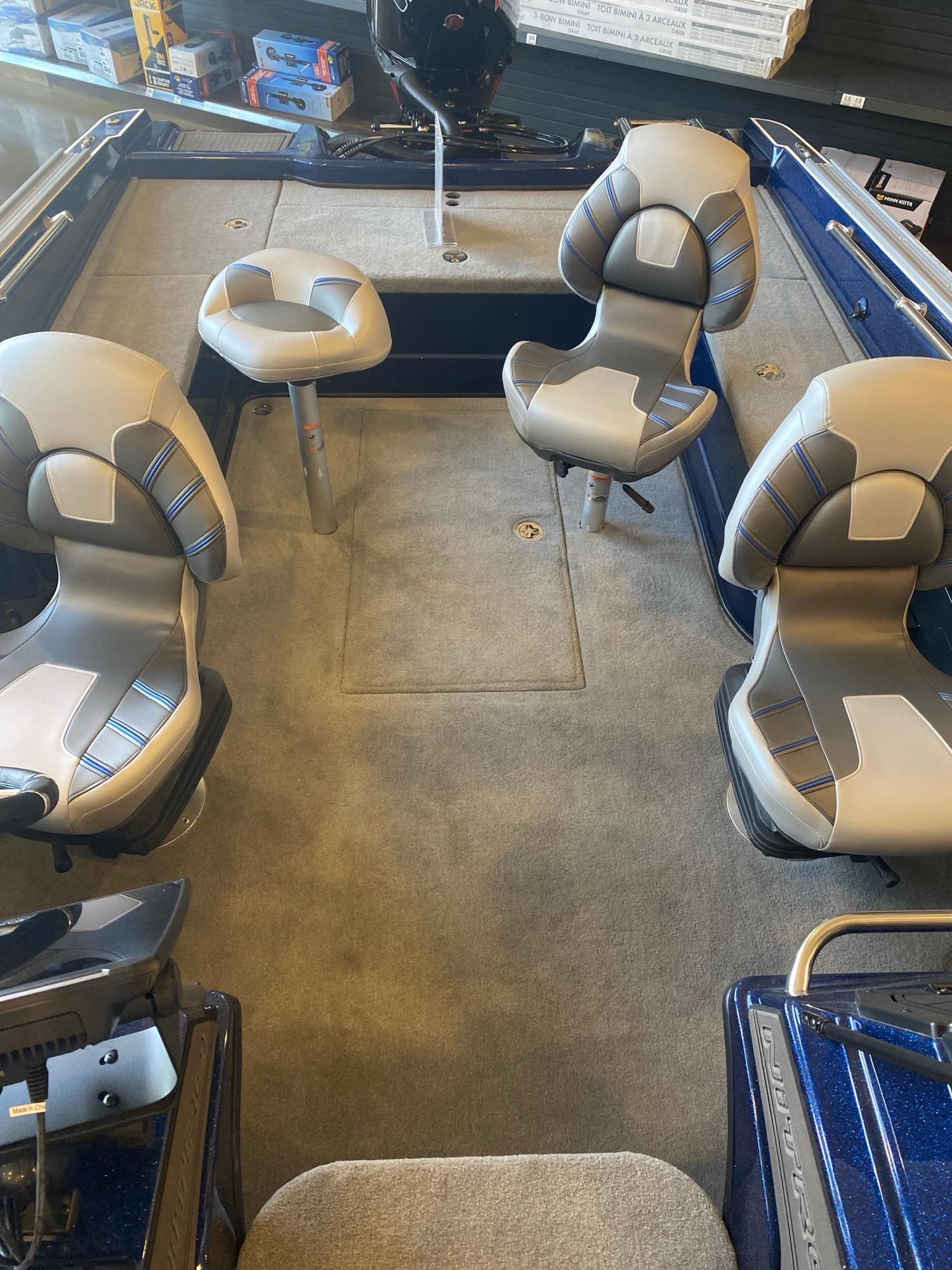 2025 Nitro ZV20 Pro boat interior with four cushioned seats and carpeted flooring.