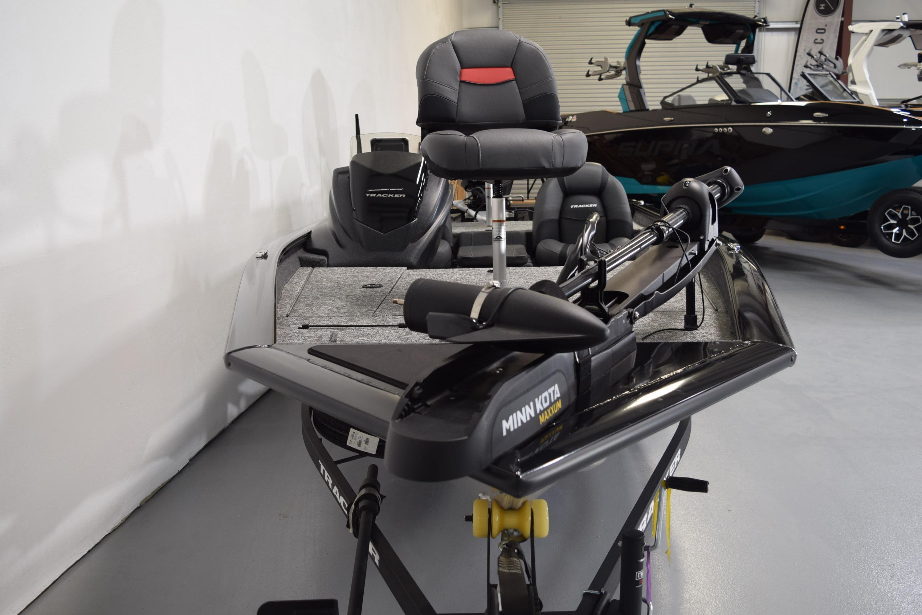 2026 Tracker Pro Team 175 boat with Minn Kota trolling motor in showroom.