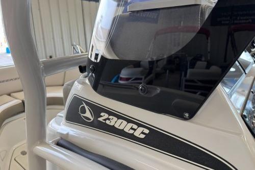 2026 Crownline 230 FinSeeker boat console with windshield and seating detail.
