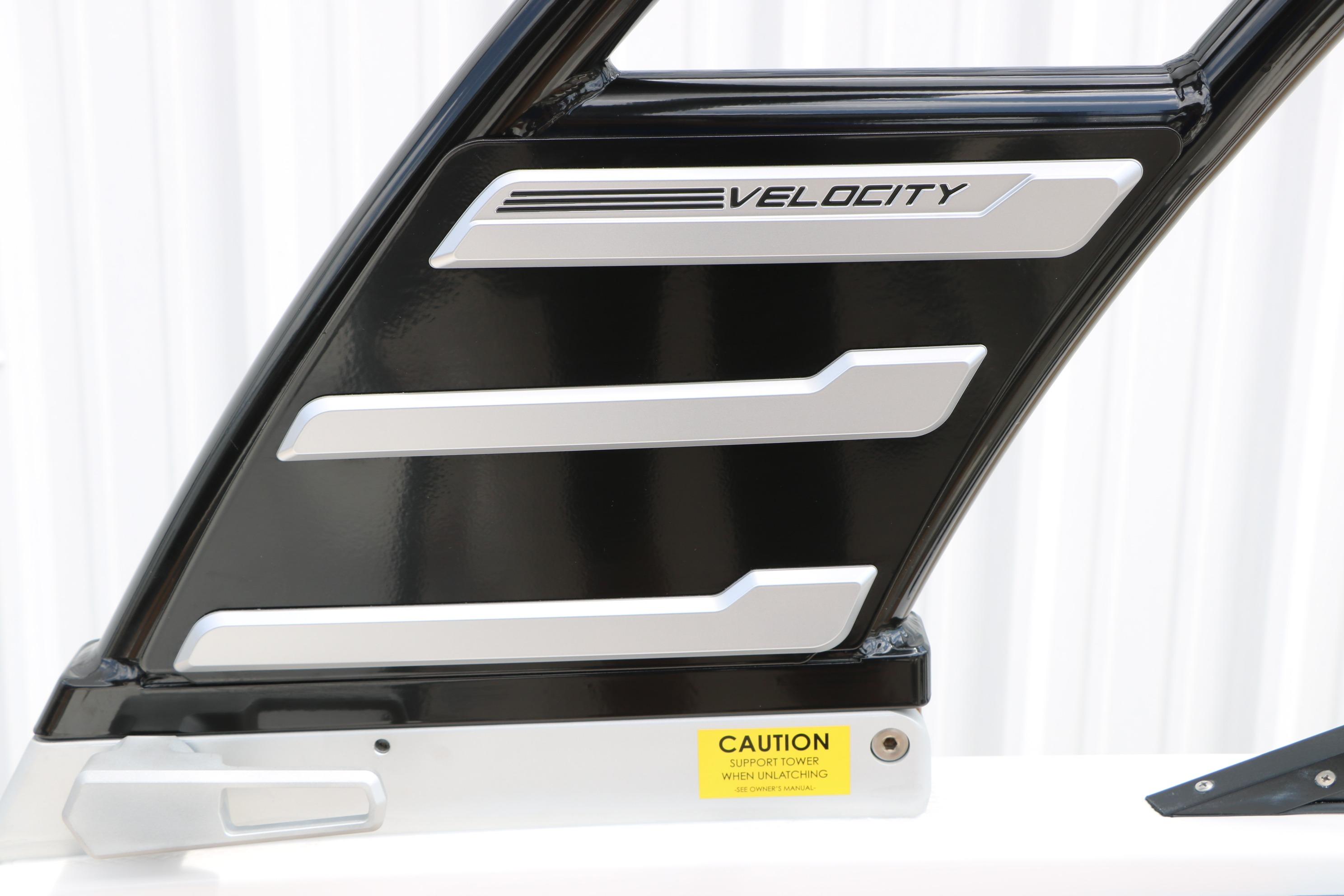 2025 Chaparral 23 SSi boat tower detail with "Velocity" branding and caution label.