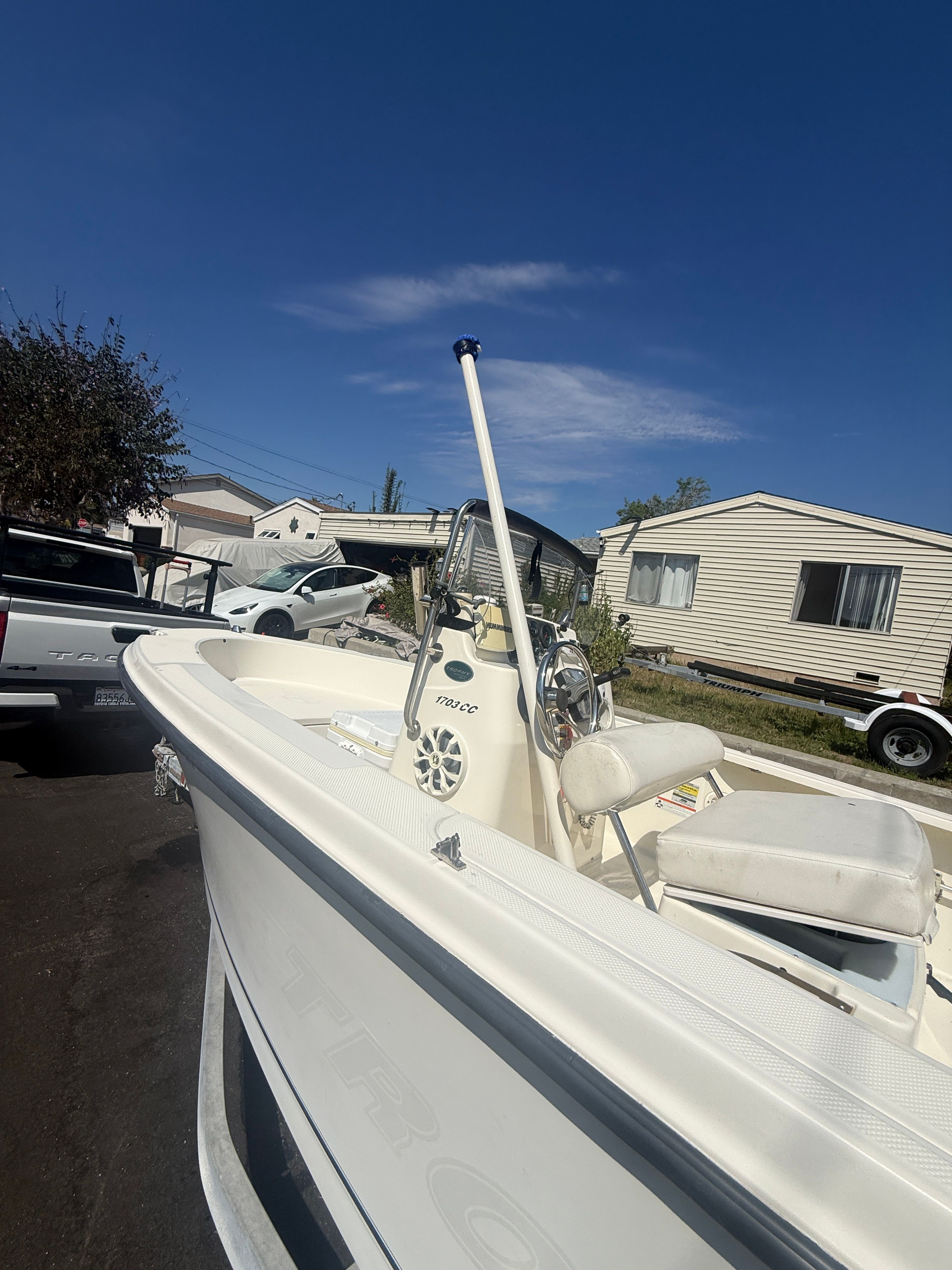 2008 Trophy 1703 Center Console boat on trailer outdoors.
