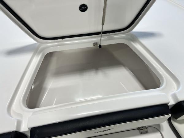 Open storage compartment on 2025 Tidewater 2300 Carolina Bay boat.