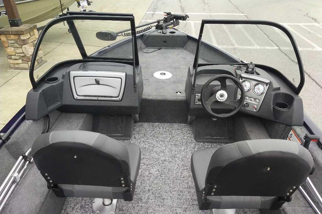 2026 Tracker Pro Guide V-16 WT boat interior with dual seats and steering console.