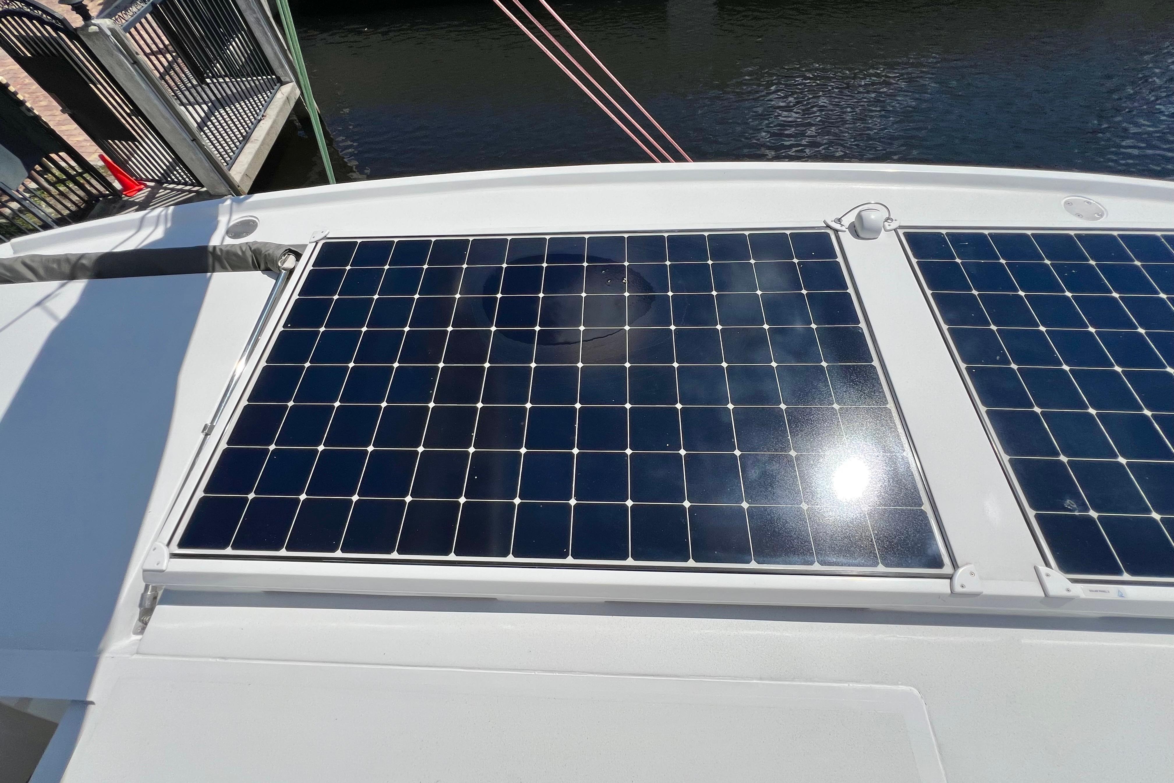 Solar panels on Balance 482 yacht, 2021 model, reflecting sunlight by the water.