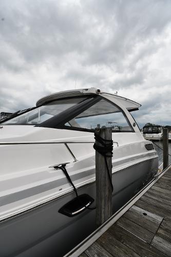 2021 Regal 35 Sport Coupe docked under cloudy skies.