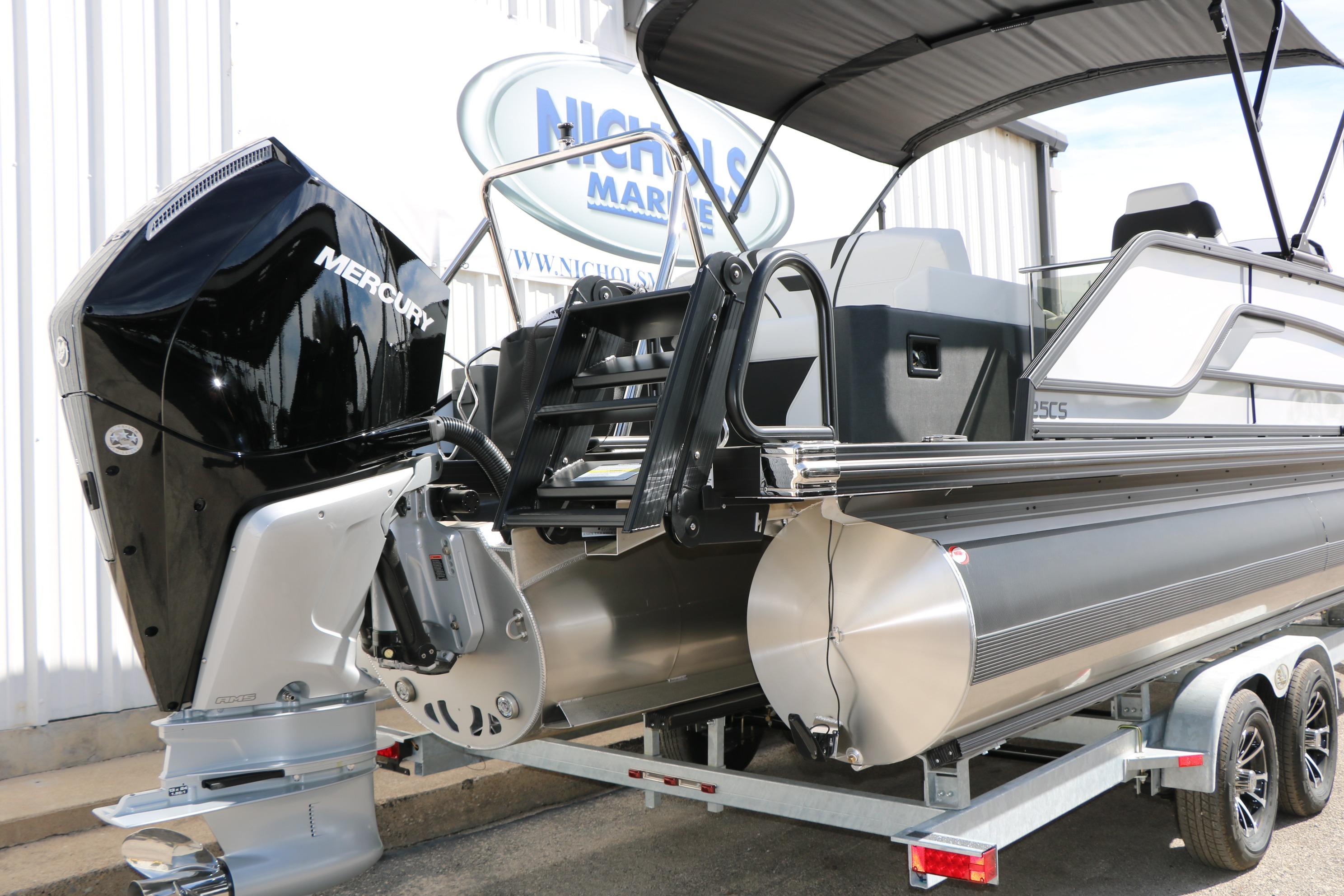2026 Evotti 725 CS Tri-Toon boat with Mercury engine on trailer.