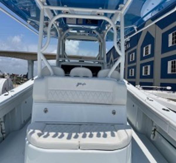 2022 Yellowfin 39 Offshore boat interior with seating and blue canopy.