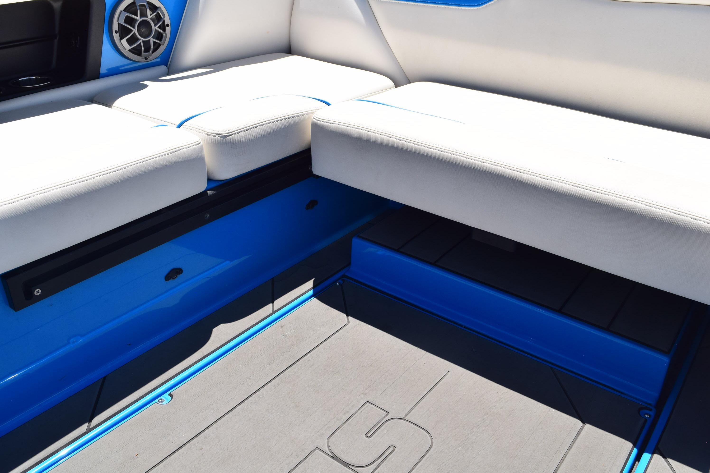 Interior seating of a 2019 Axis A22 boat with blue and white upholstery.