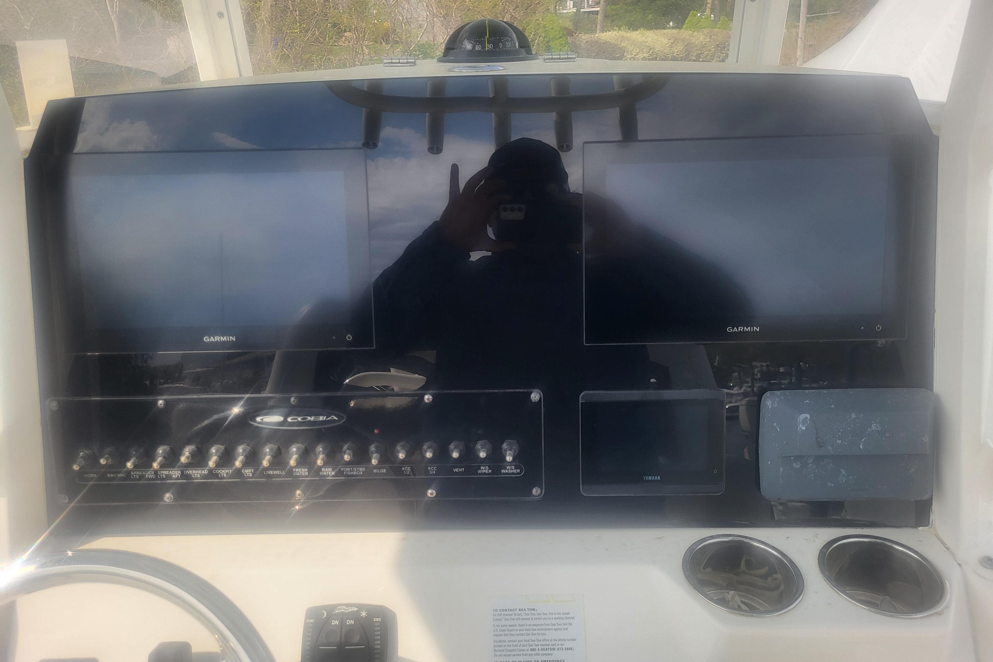2022 Cobia 262 Center Console dashboard with Garmin displays and control panel.